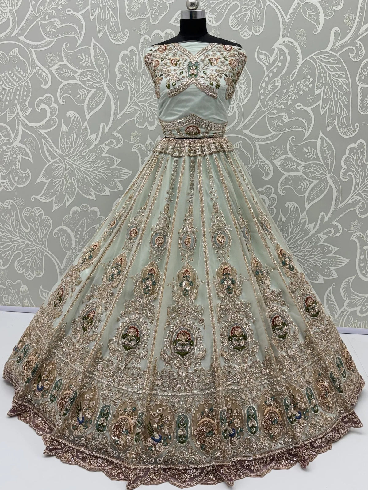 Rich Mint Green Heavy Embroidered Net Reception Wear Lehenga Choli