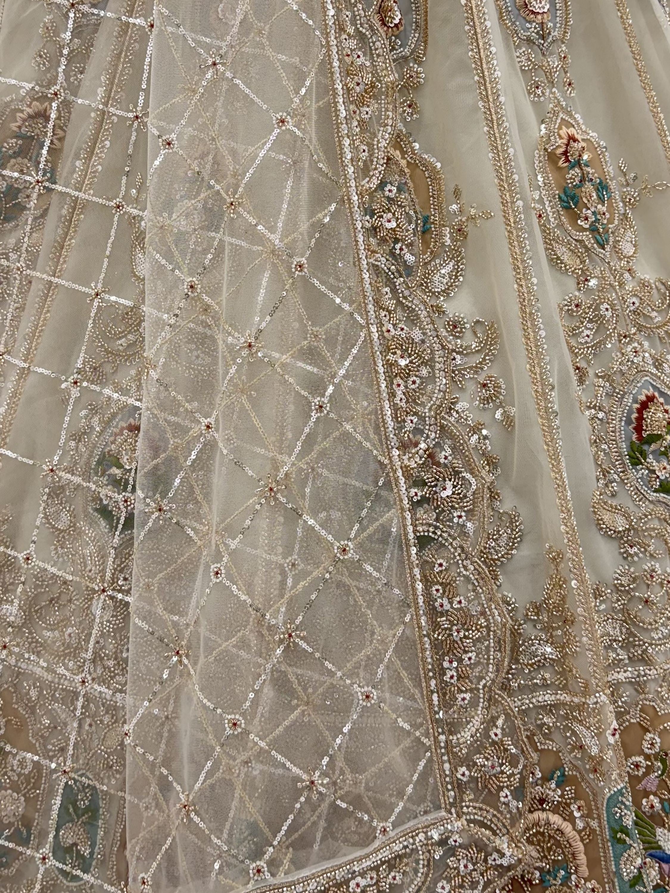 Noteworthy Beige Zari Work Net Sangeet Wear Lehenga Choli With Dupatta