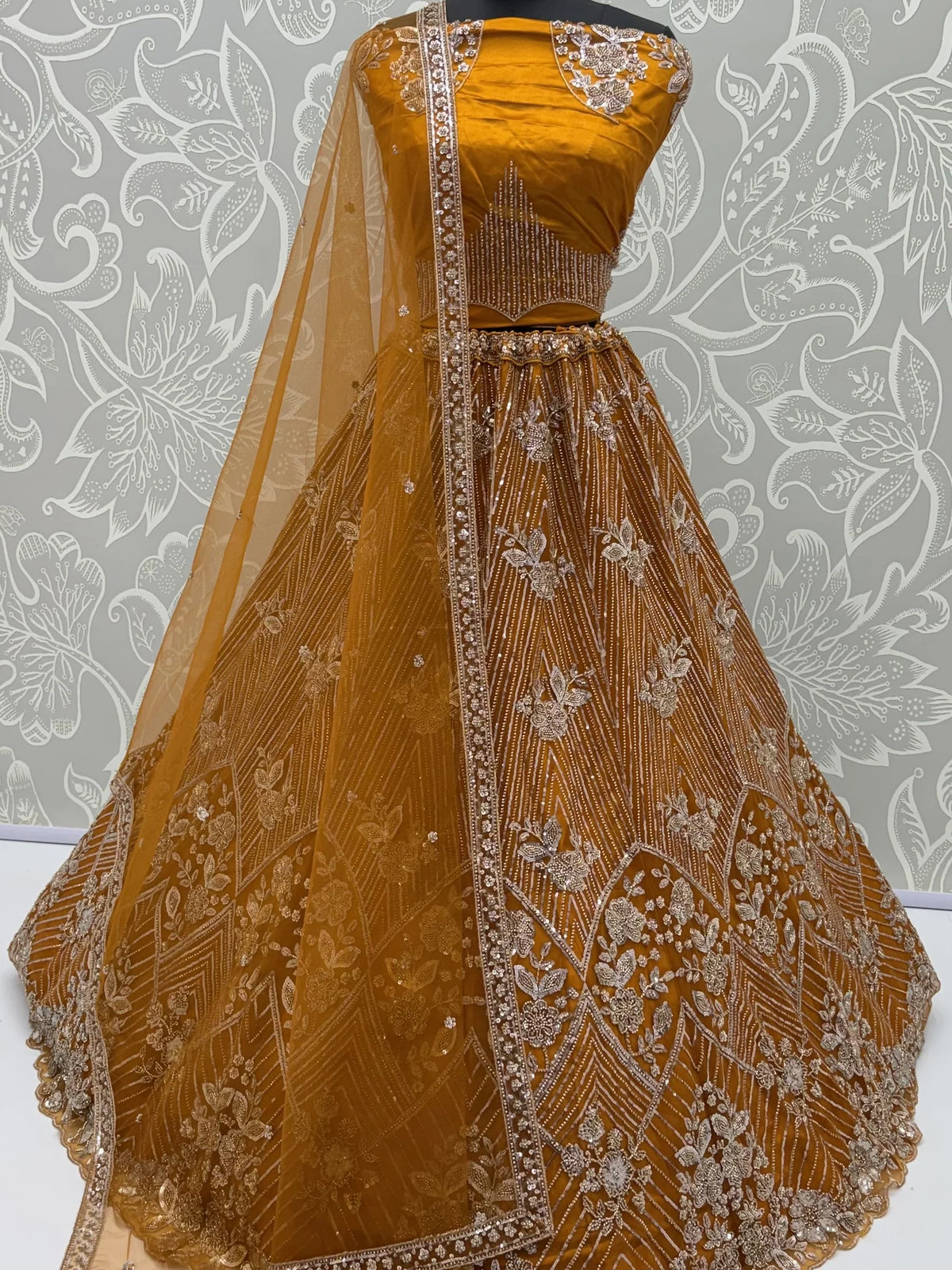 Glowing Mustard Yellow Bead Work Net Reception Wear Lehenga Choli