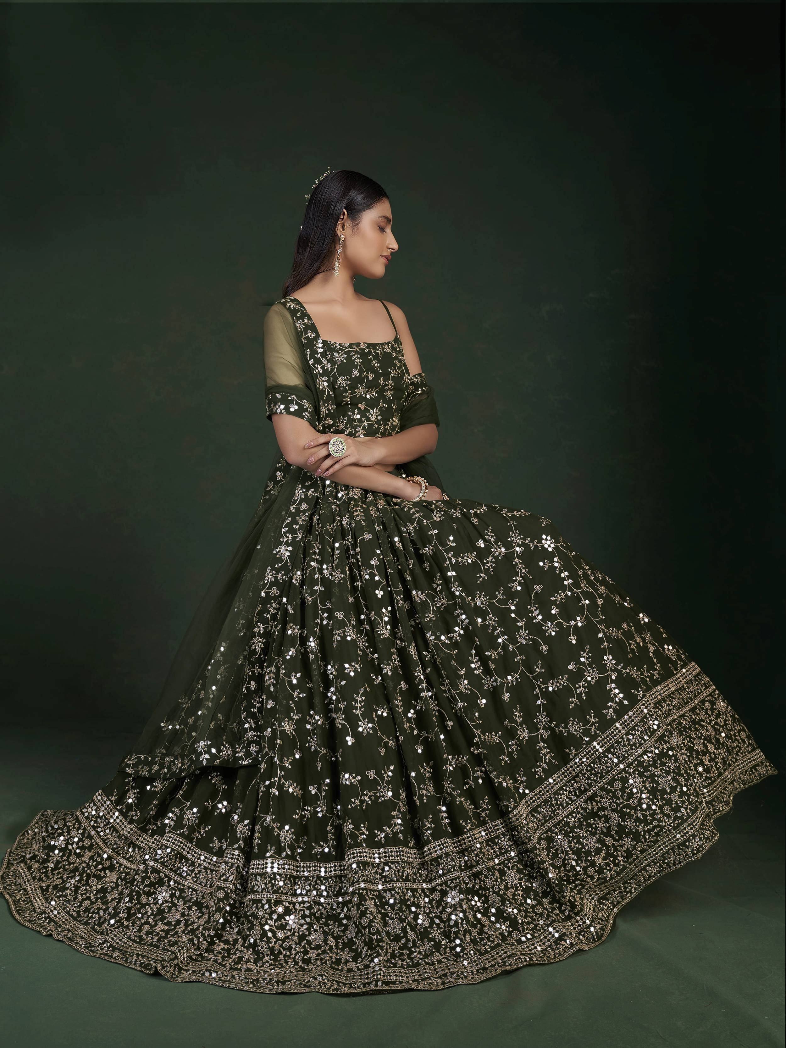 Elegant olive green lehenga choli with gold floral embroidery and sequin detailing, perfect for Indian ethnic occasions.