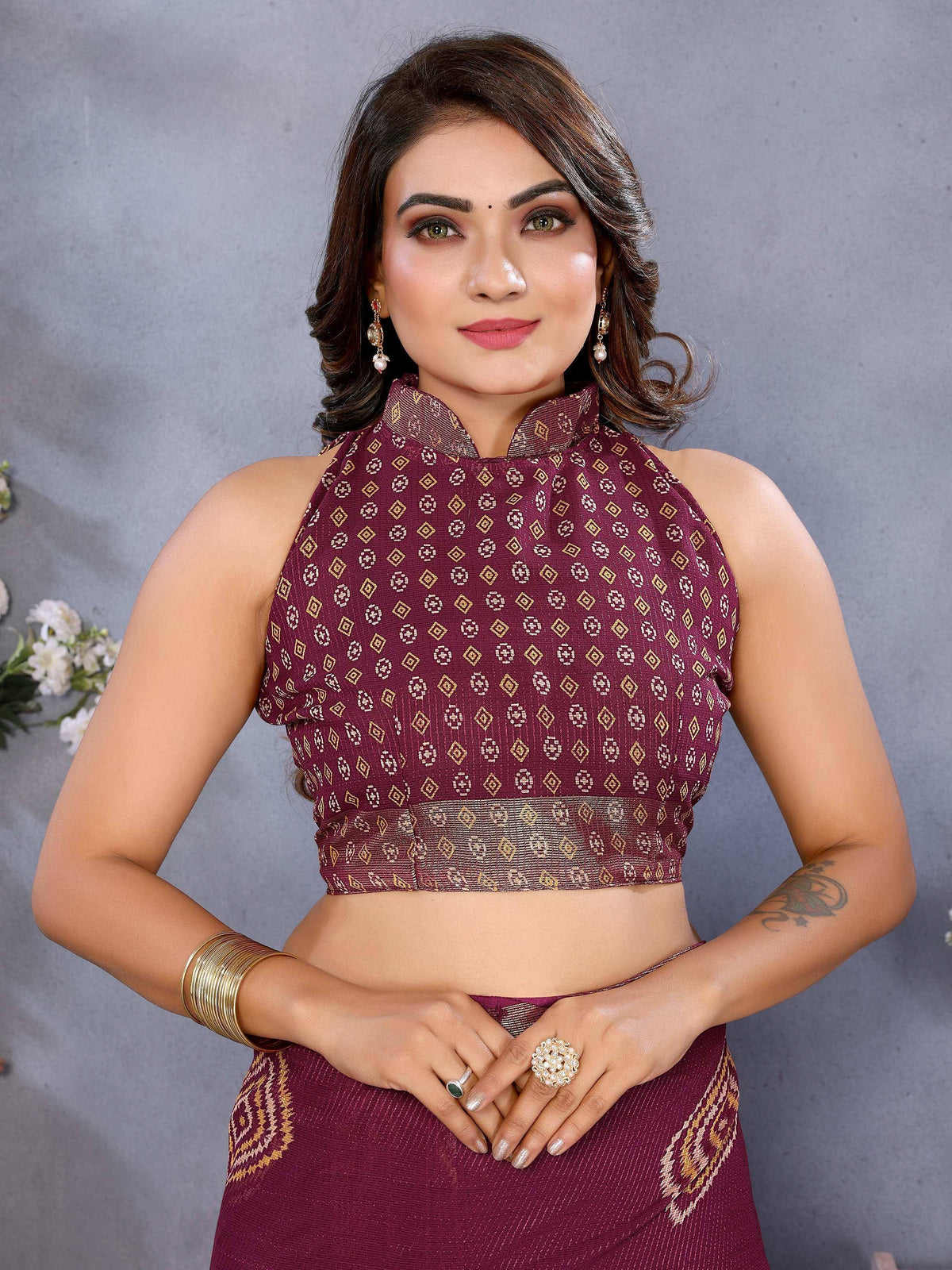 Maroon ethnic crop top with gold geometric print, paired with matching skirt, perfect for Indian festive wear