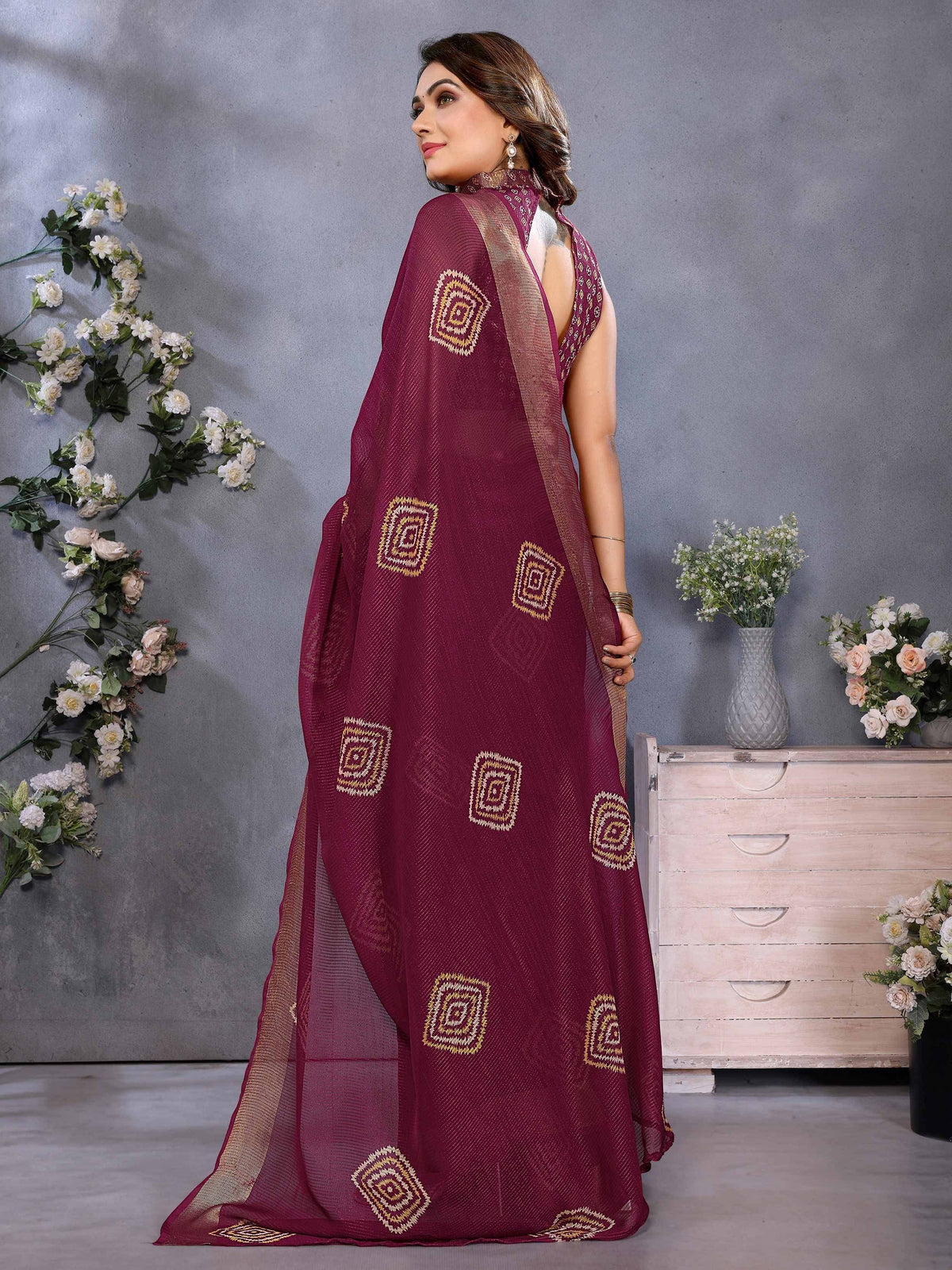 Maroon ethnic saree with gold geometric embroidery, perfect for Indian occasions and festive wear