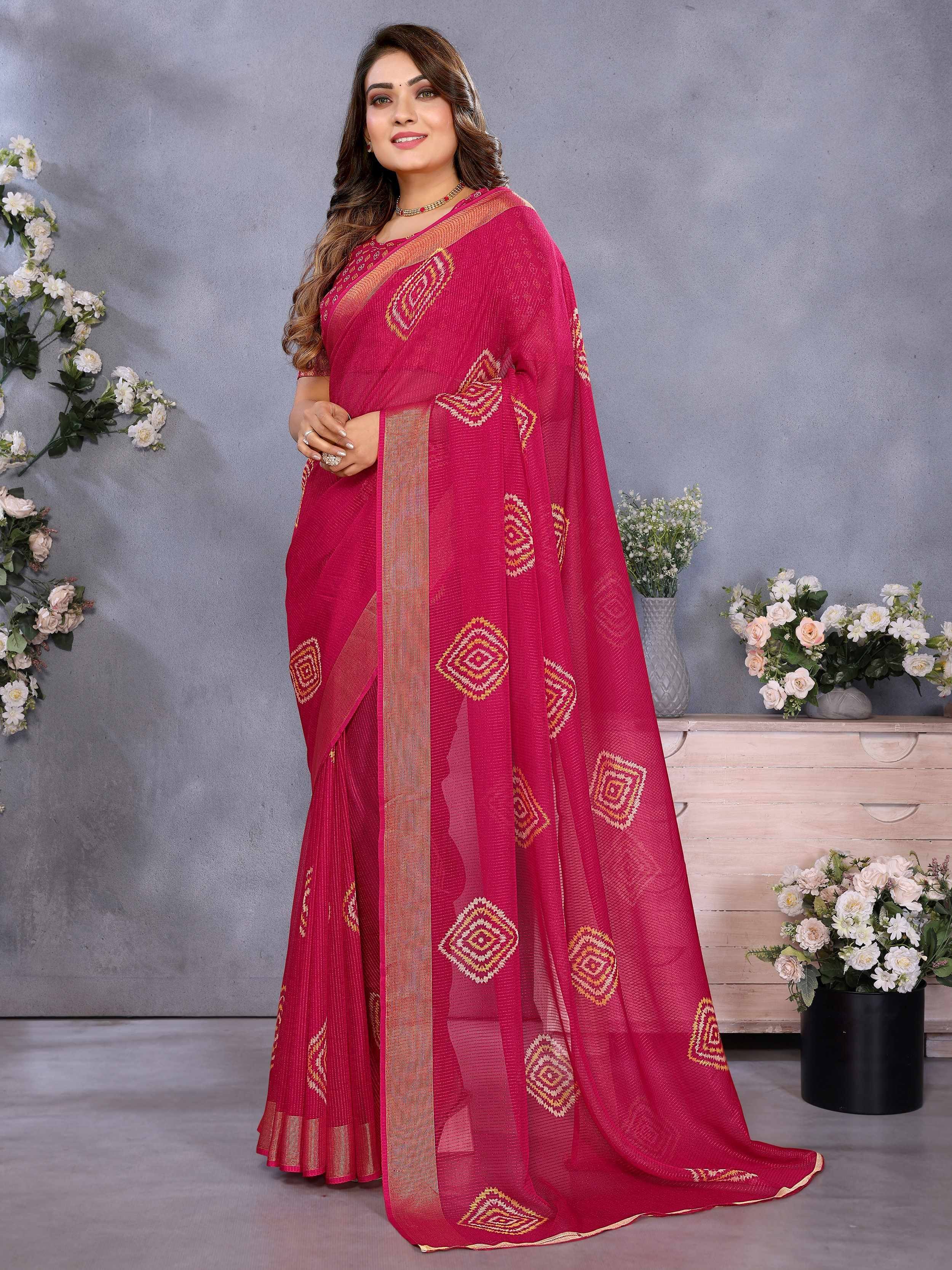 Elegant pink saree with geometric embroidery and golden border, perfect for Indian ethnic occasions.