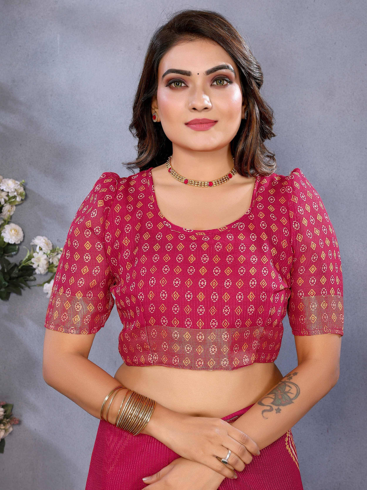 Pink ethnic blouse with gold geometric print, puff sleeves, paired with matching skirt for Indian wear