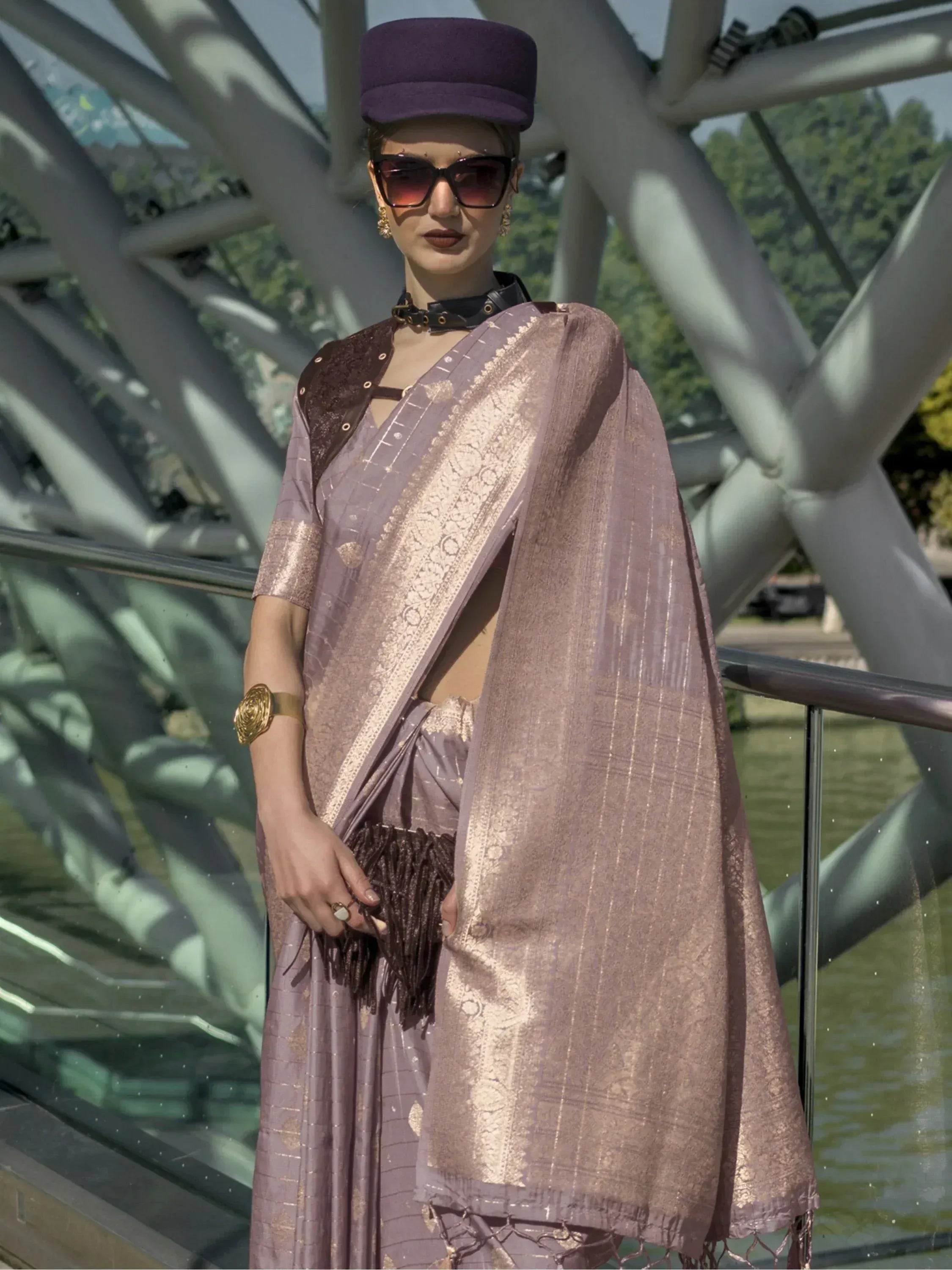 Stylish mauve saree with gold zari, modern blouse, and purple cap for ethnic fashion