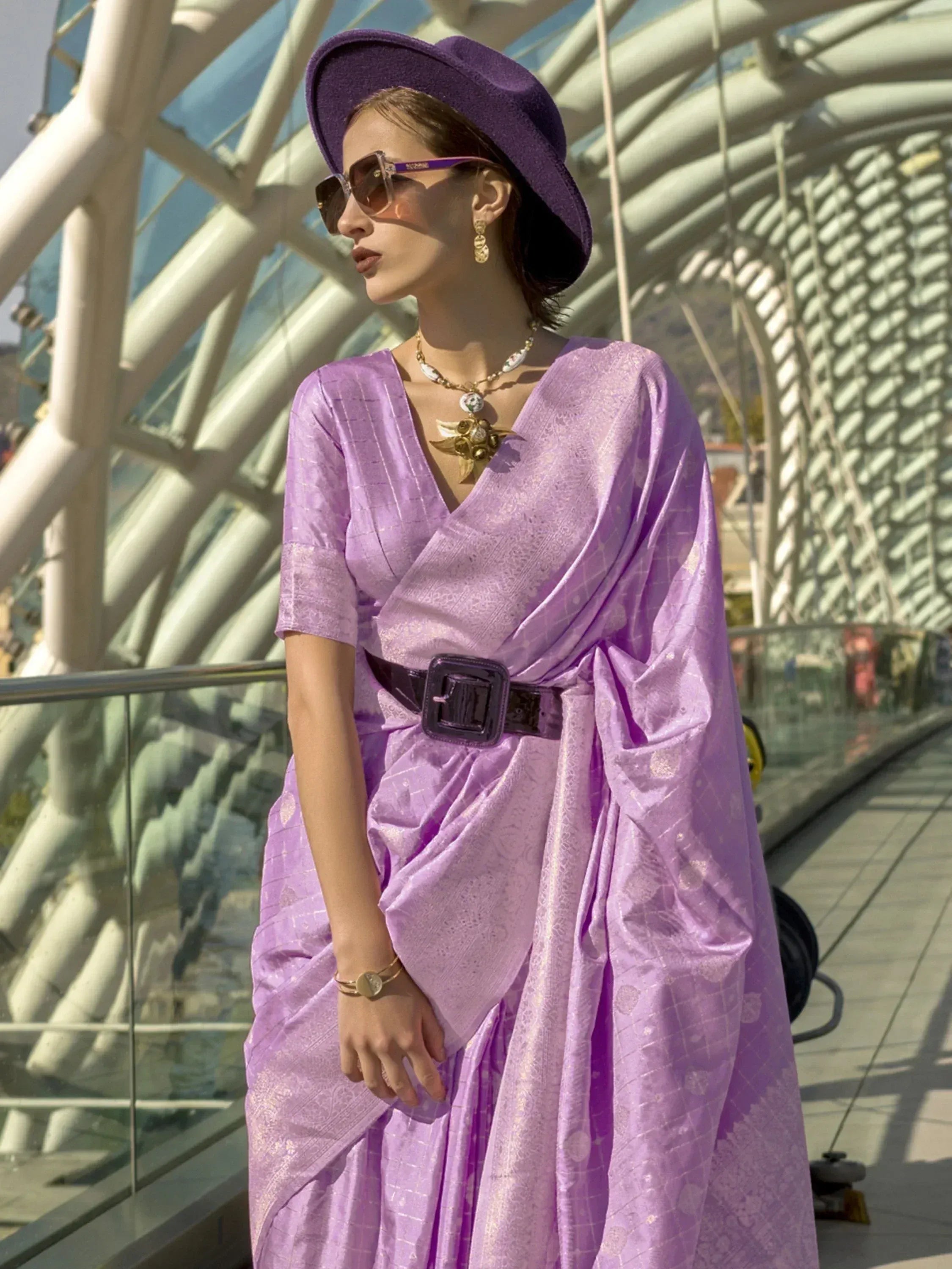 Purple ethnic gown with belt, hat, and sunglasses for modern Indian fashion