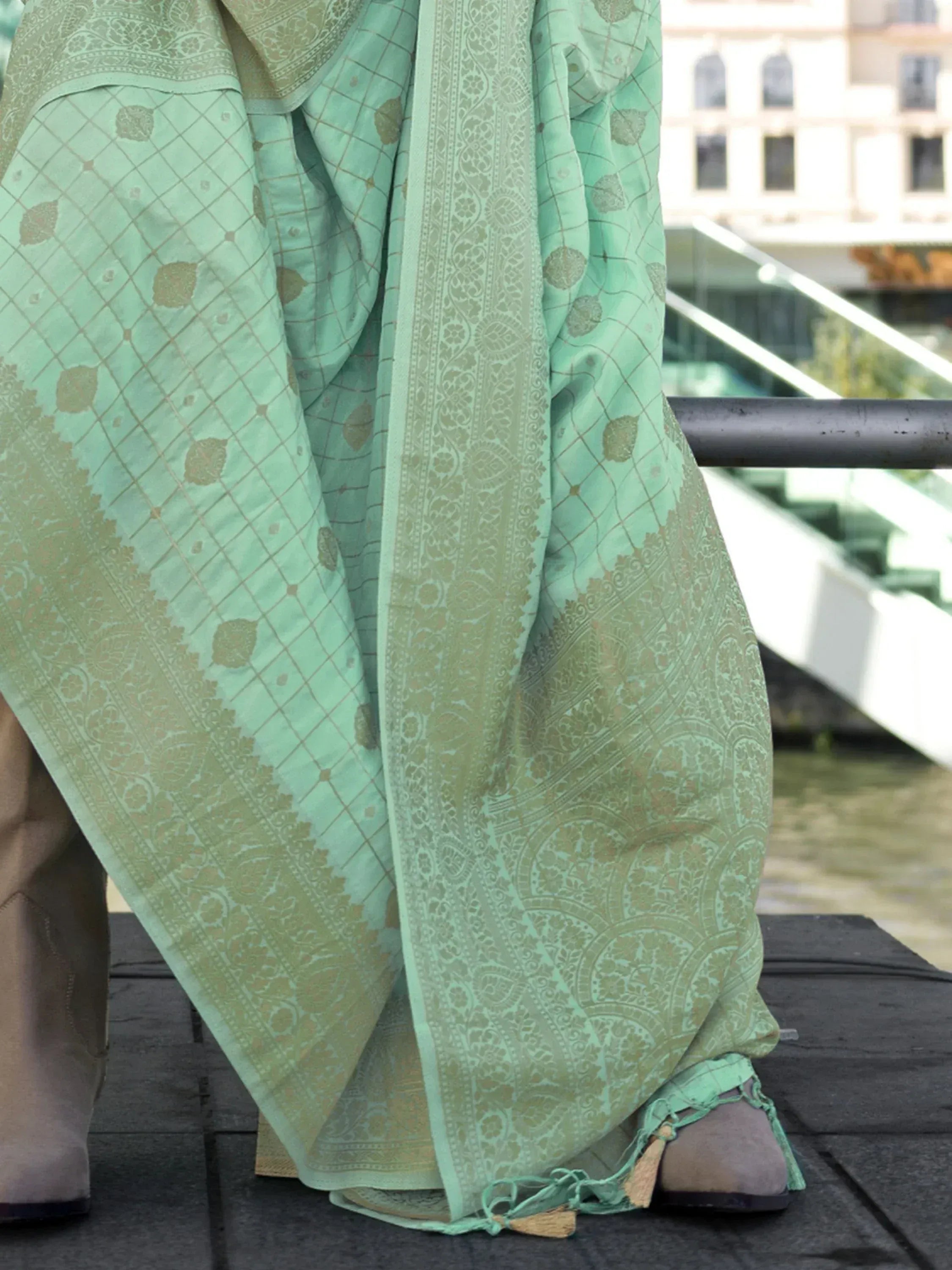 Mint green designer saree with gold paisley and geometric print, perfect for ethnic wear occasions