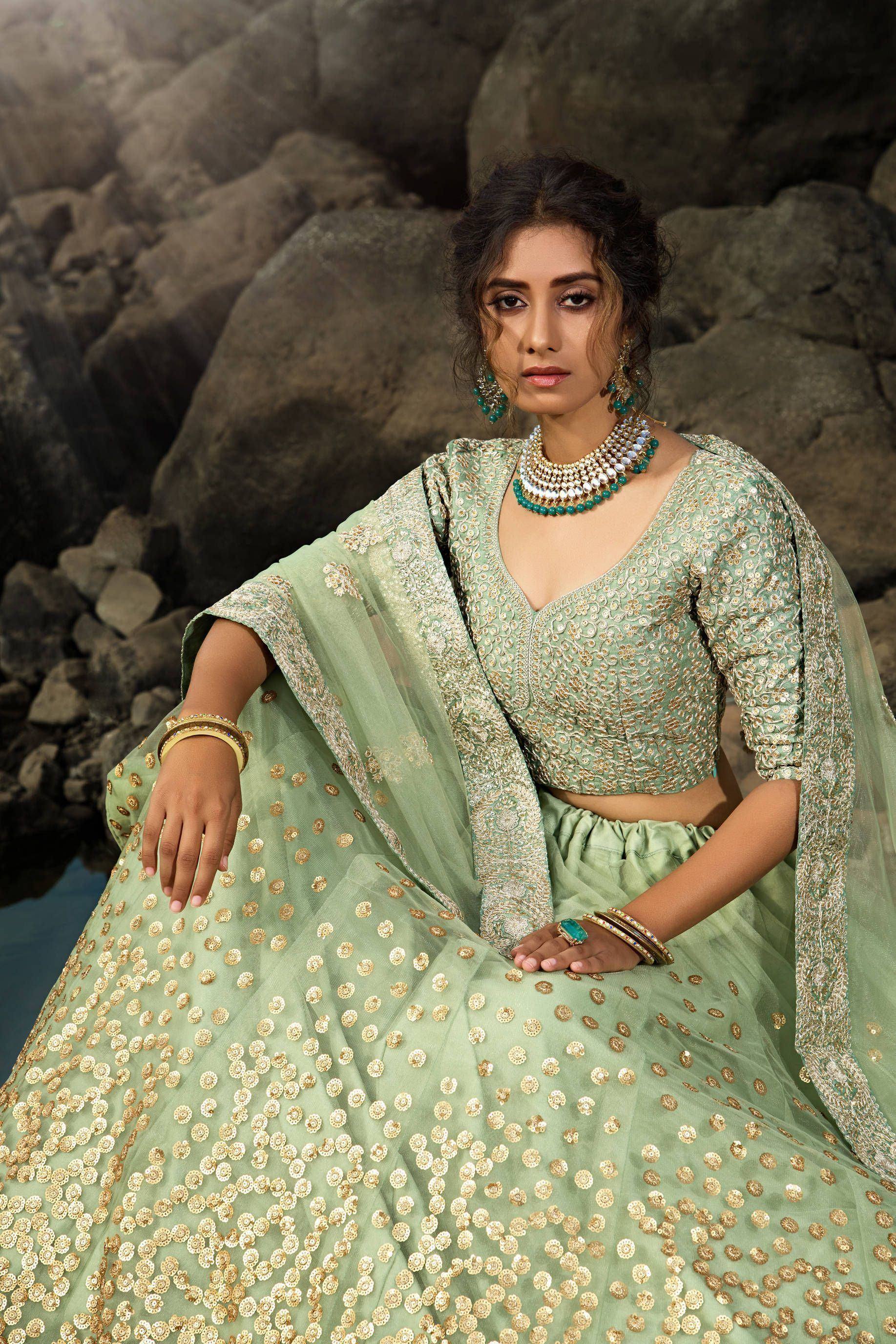 Mint green designer lehenga choli with gold embroidery, perfect for Indian ethnic wear occasions