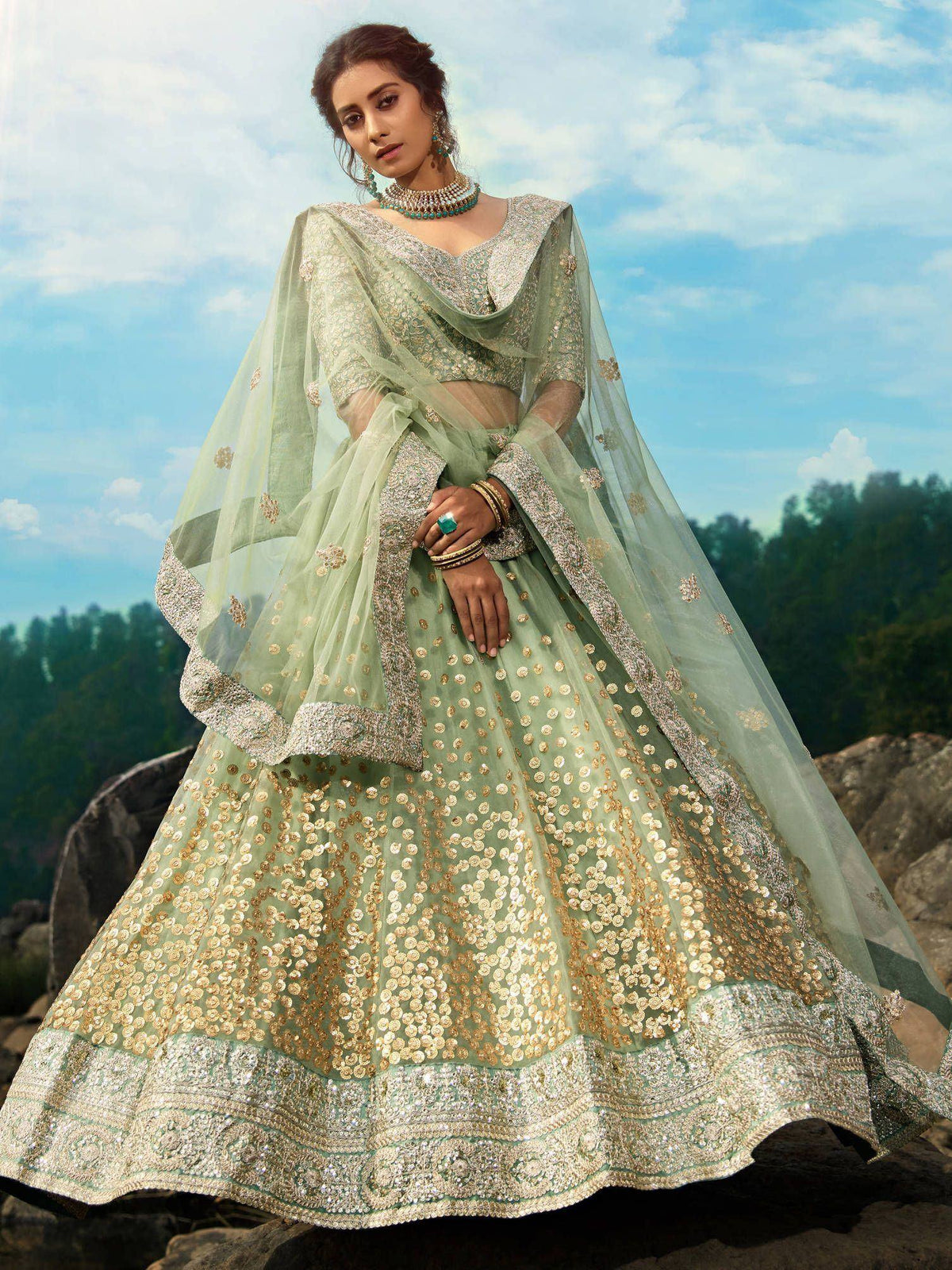 Mint green designer lehenga choli with gold embroidery, perfect for weddings and ethnic events