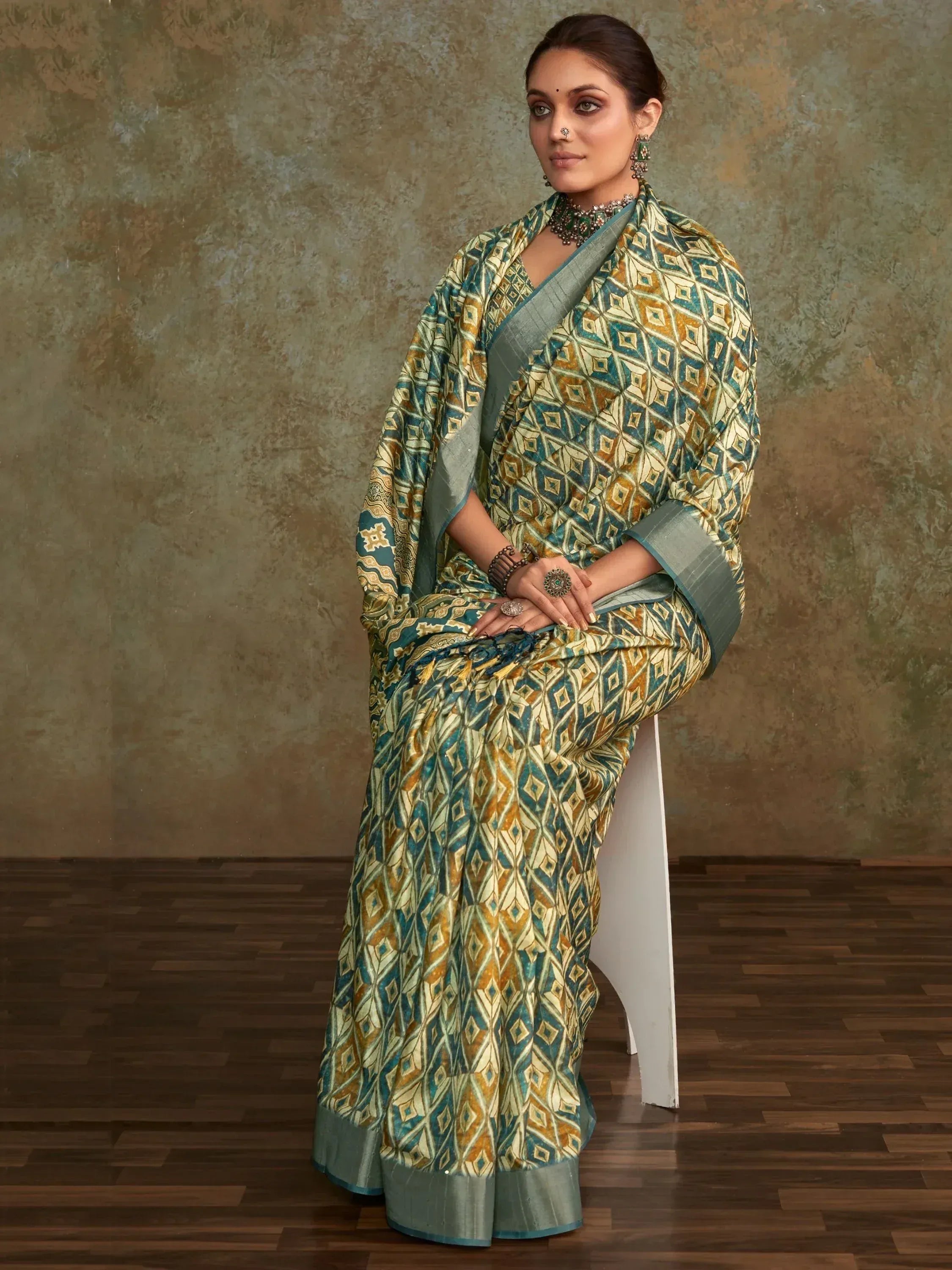 Woman in elegant ethnic saree with geometric print, perfect for Indian occasions and festive wear.