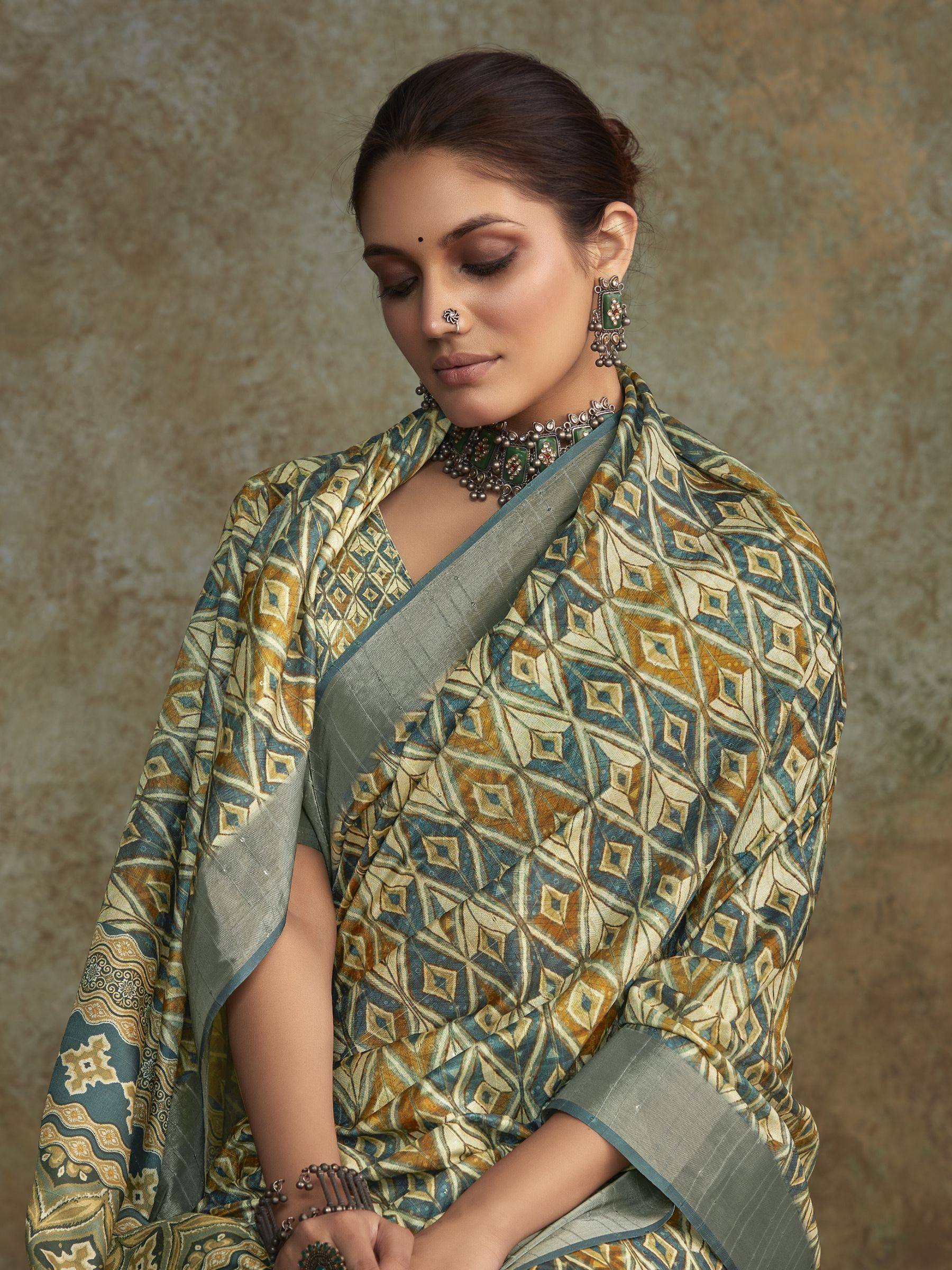 Woman in elegant Indian saree with geometric print, traditional jewelry, and ethnic styling for festive occasions