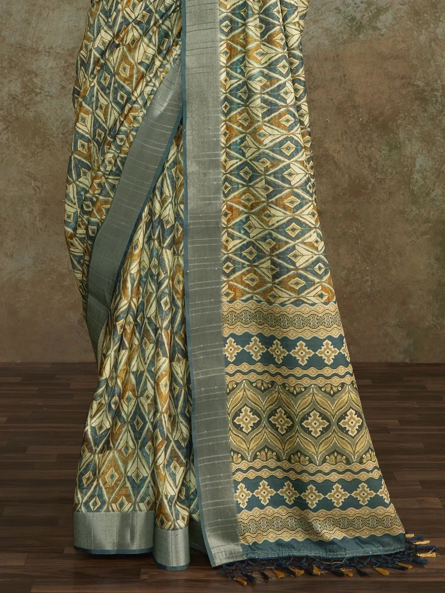Blue and gold geometric print saree with woven border and tassels, ethnic Indian wear