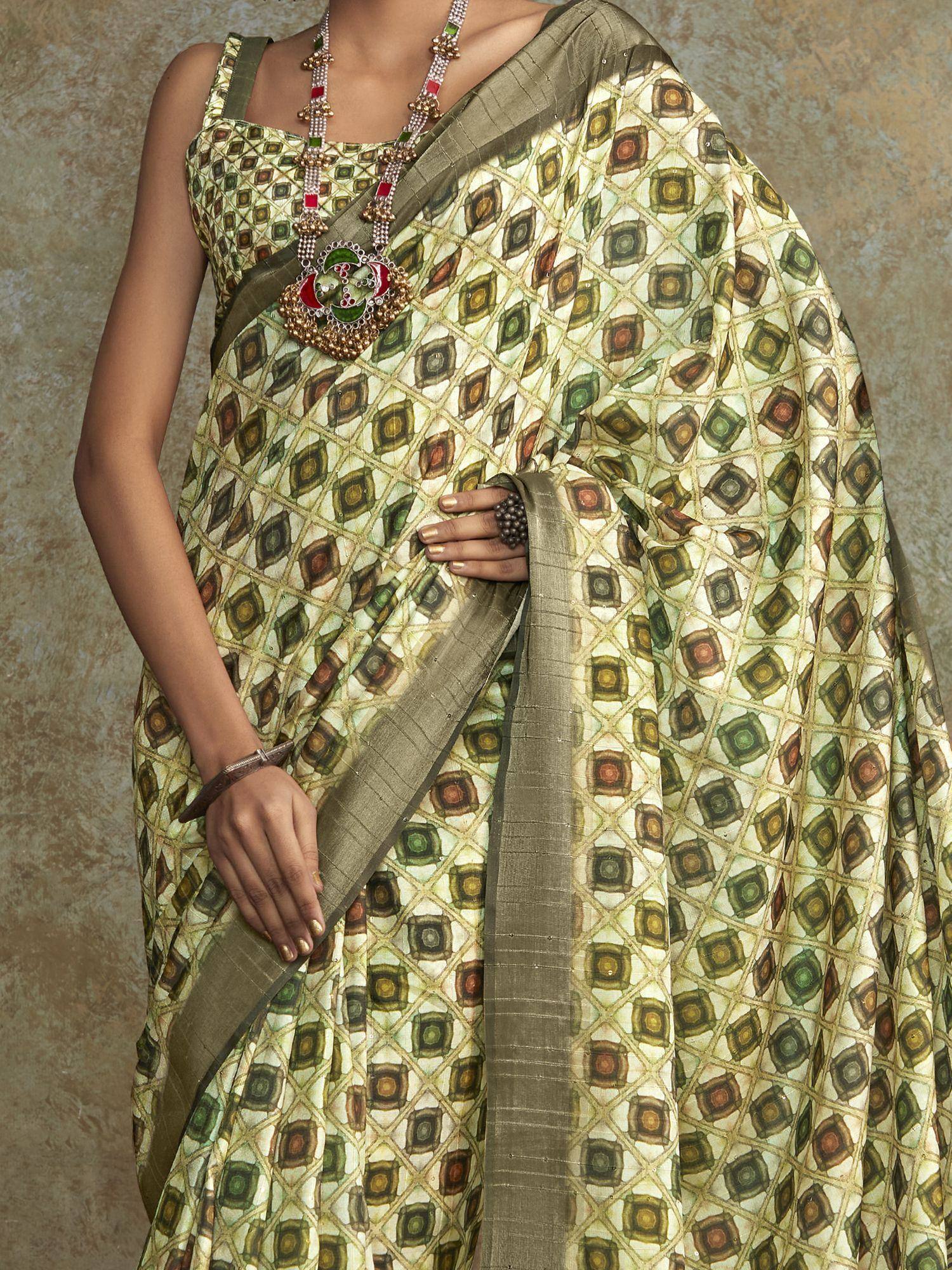 Green geometric print saree with matching blouse and traditional jewelry for ethnic wear