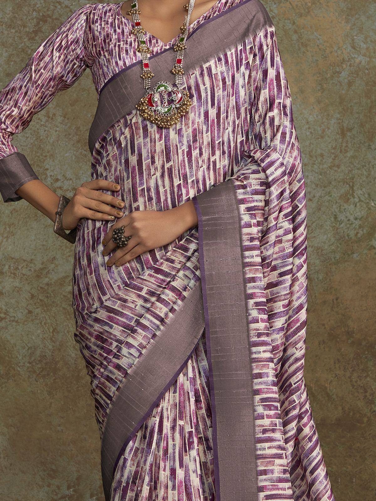 Purple printed saree with geometric pattern, paired with matching blouse and traditional jewelry