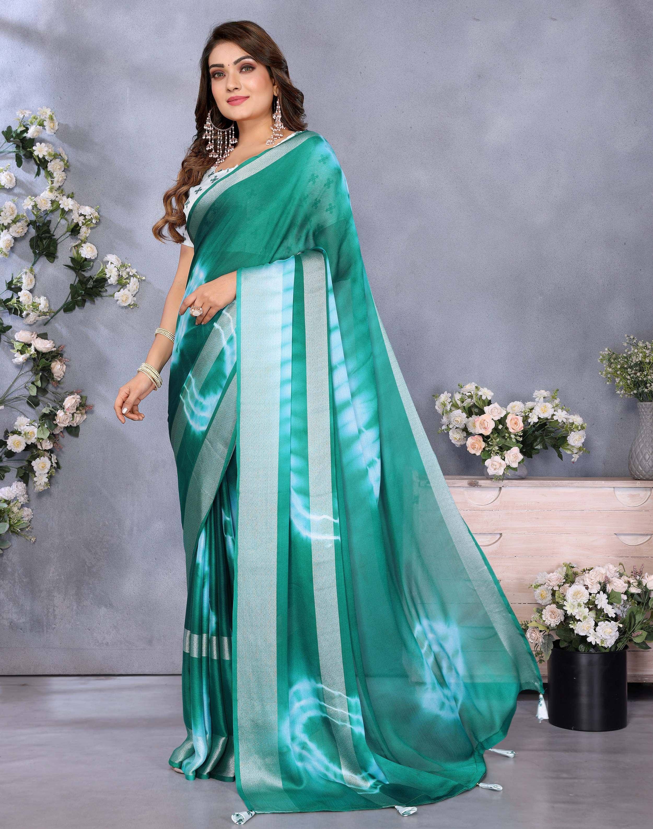 Elegant green saree with silver stripes, perfect for ethnic occasions and festive wear.
