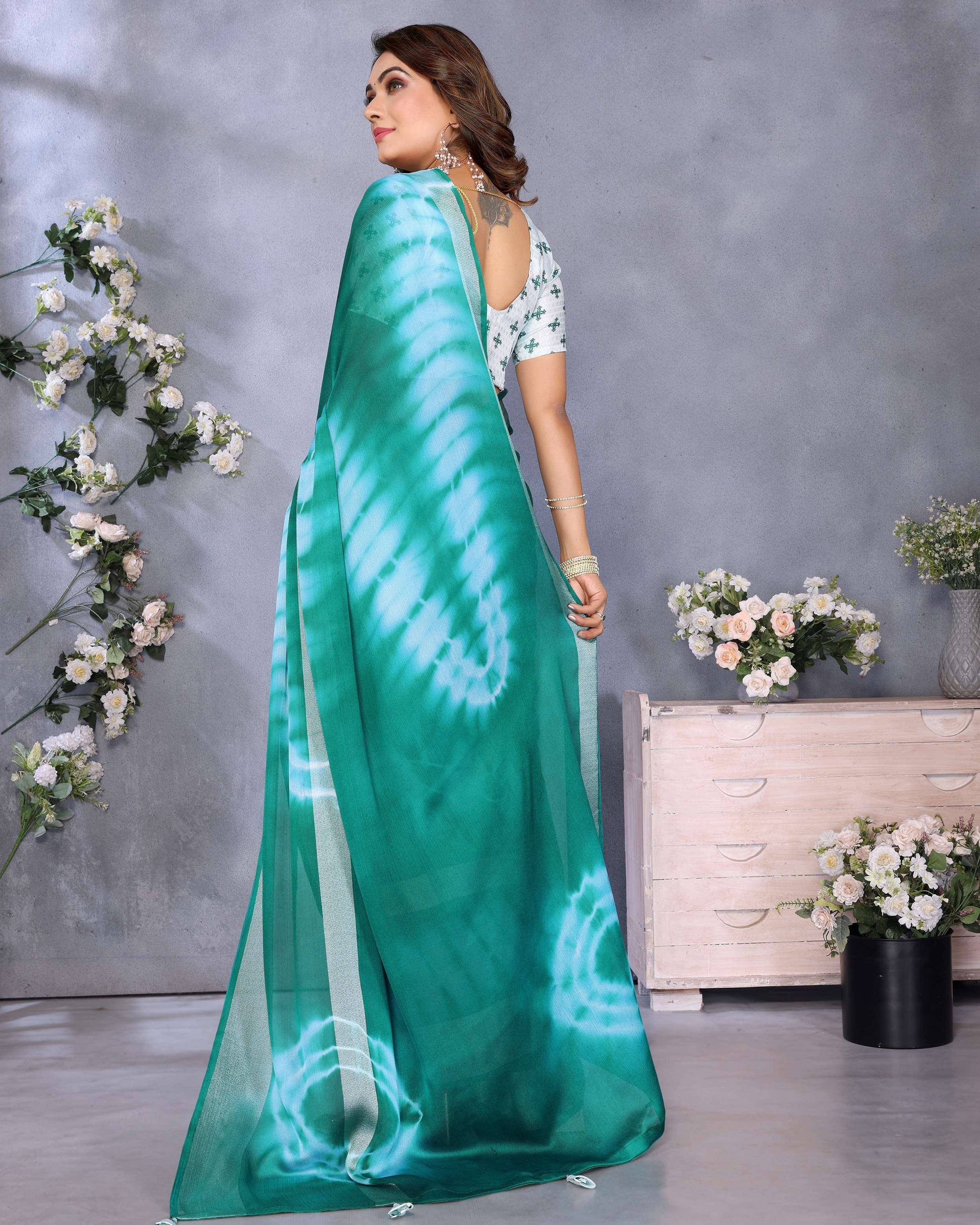 Elegant green tie-dye saree with white blouse, perfect for Indian ethnic wear occasions.