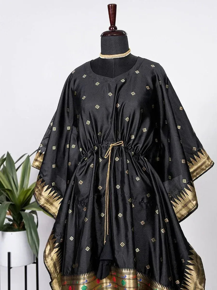 Black ethnic gown with gold geometric print and border, drawstring waist, displayed on mannequin