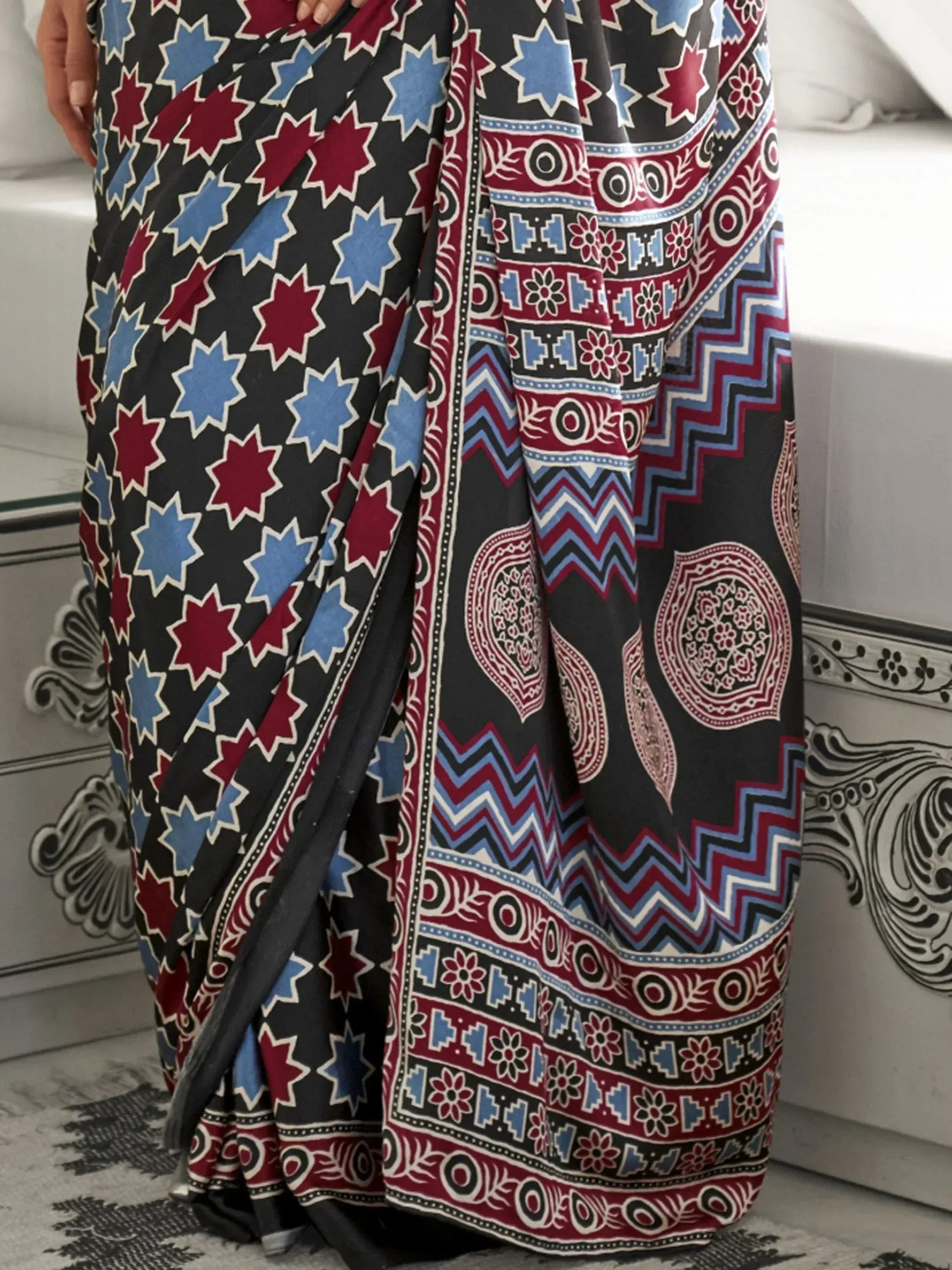 Black saree with red and blue geometric and floral print, ethnic Indian wear