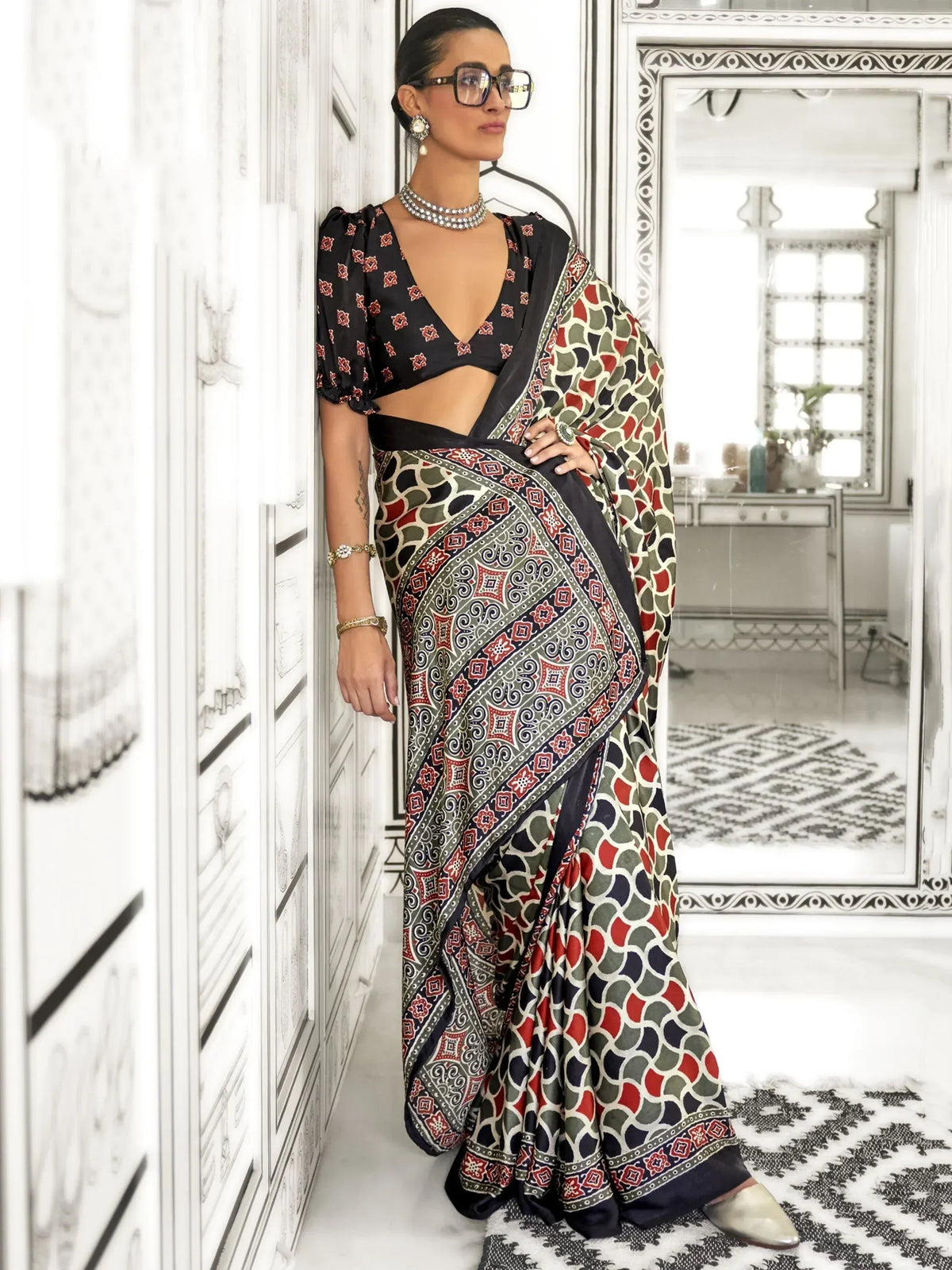 Woman in printed ethnic saree with puff sleeve blouse, stylish Indian wear for occasions