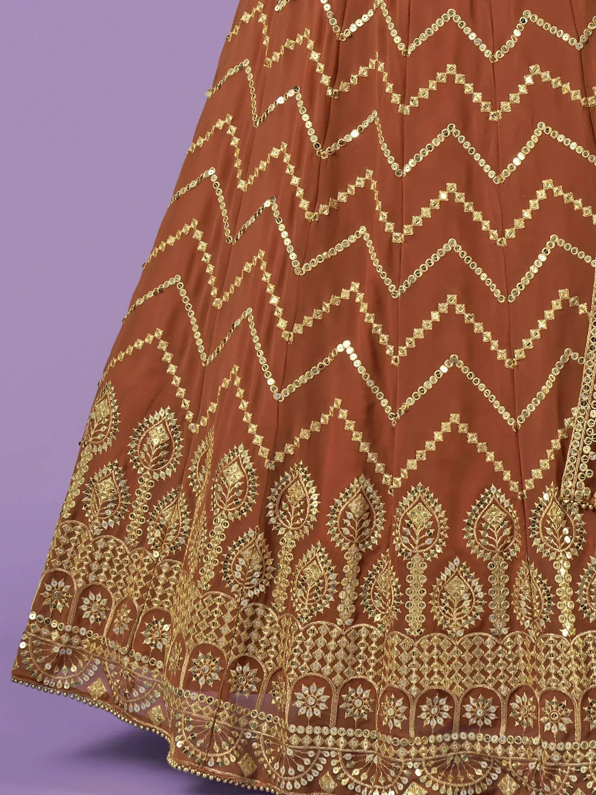 Brown lehenga with gold sequin embroidery and intricate patterns