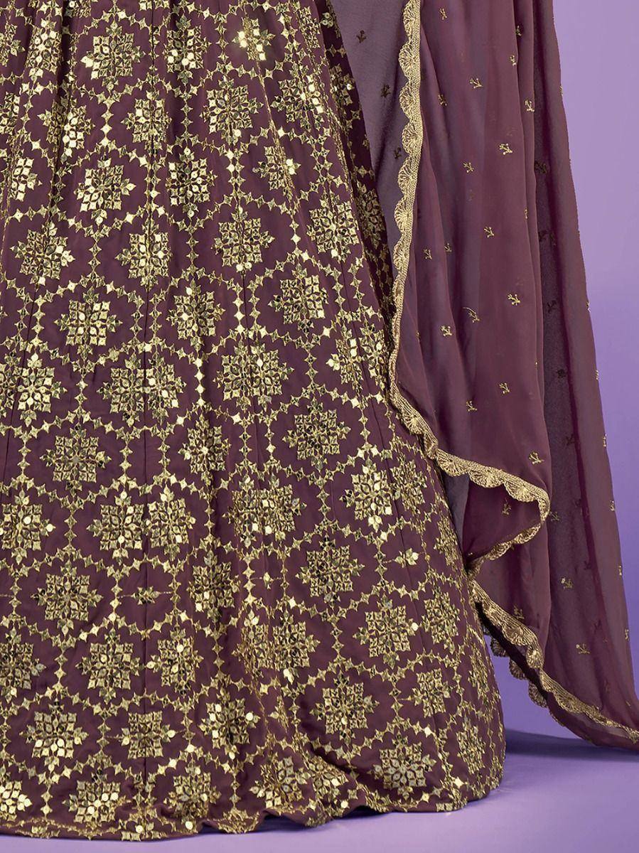 Elegant maroon lehenga with gold floral embroidery and scalloped dupatta, perfect for Indian ethnic wear