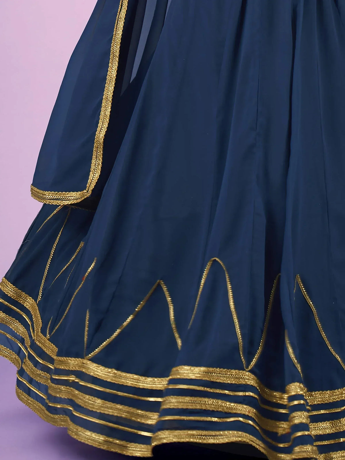 Navy blue ethnic gown with golden embroidery and pleated design for festive occasions