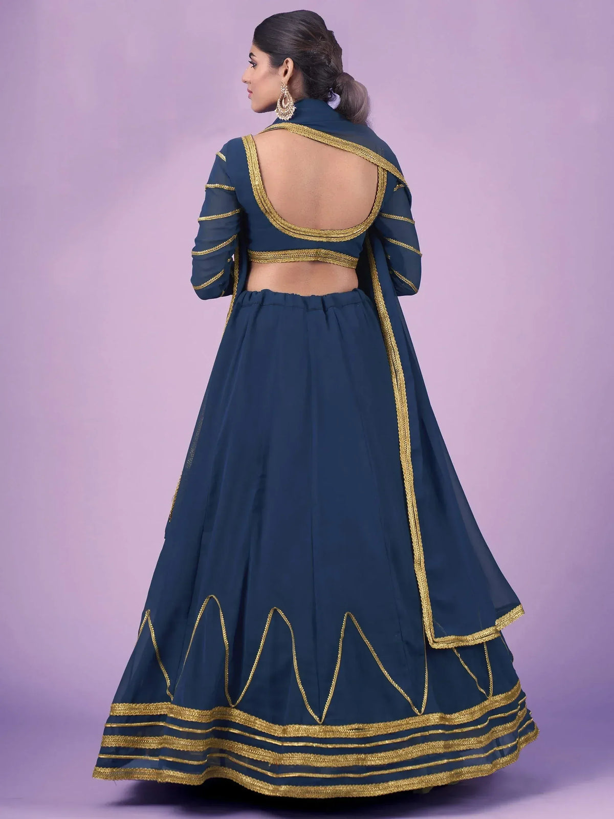 Navy blue lehenga choli with gold embroidery and open back design