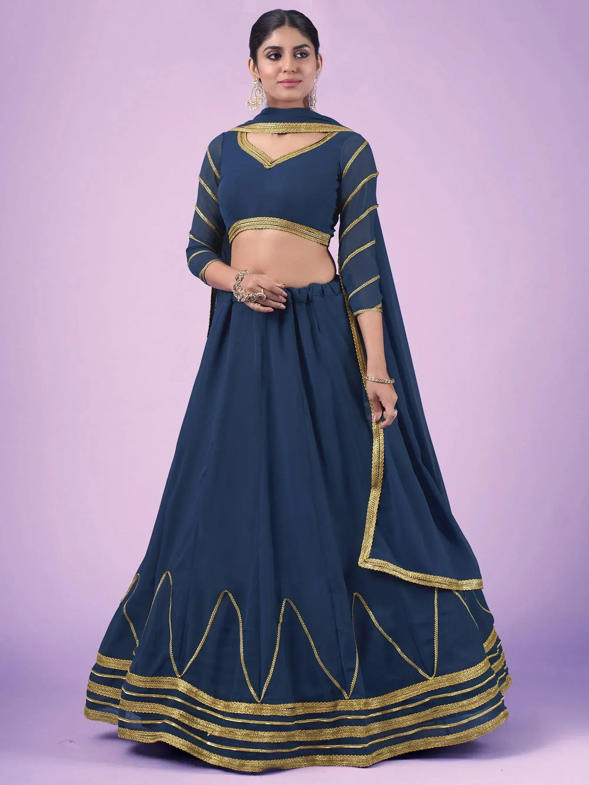 Navy blue lehenga choli with gold embroidery, perfect for Indian ethnic wear and festive occasions.