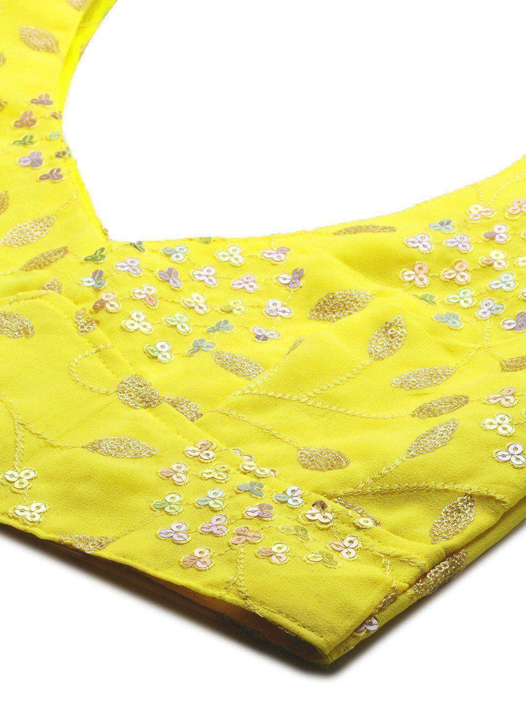 Yellow designer blouse with floral sequin embroidery, perfect for ethnic wear and festive occasions.