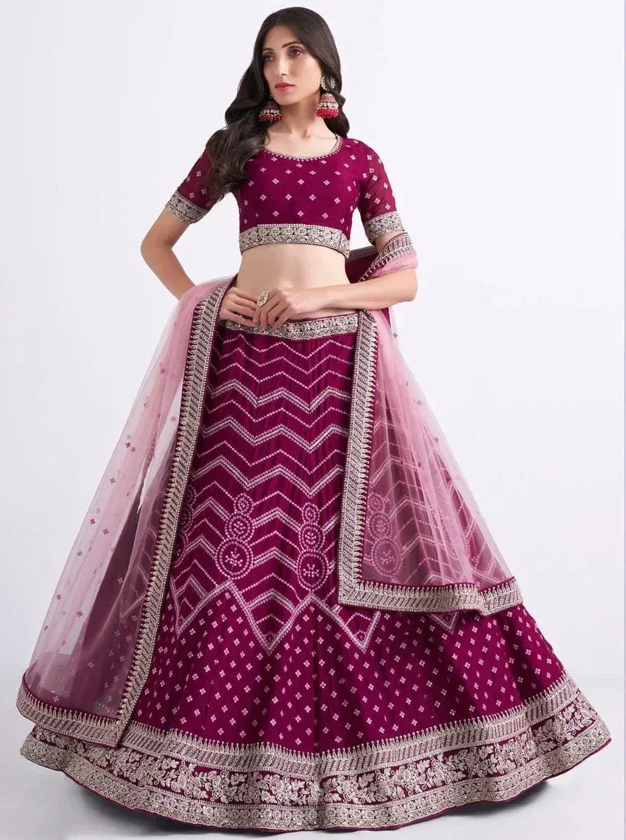 Purple designer lehenga choli with geometric embroidery and pink dupatta, perfect for Indian ethnic occasions