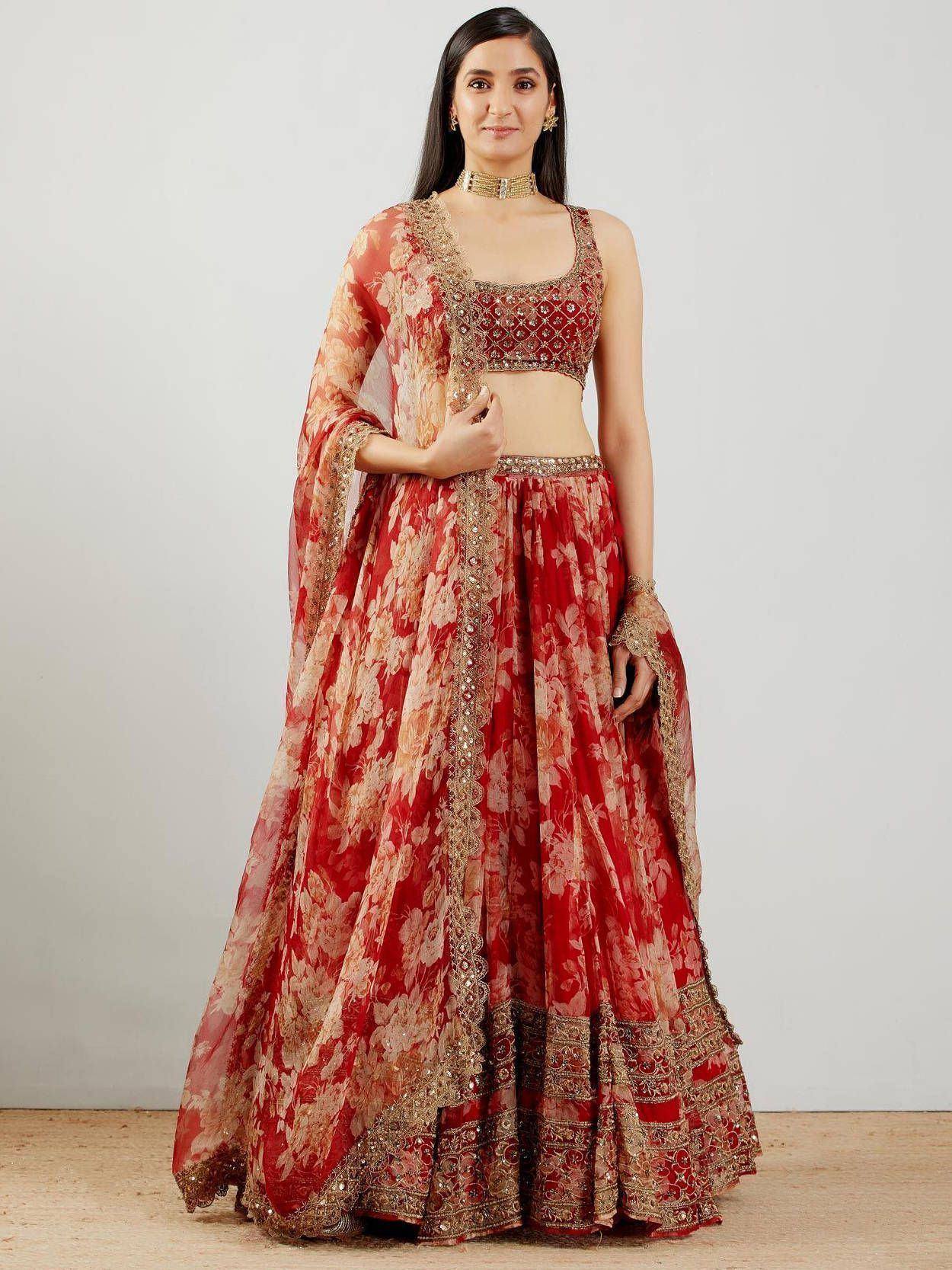 Red floral lehenga choli with gold embroidery, perfect for Indian weddings and festive occasions