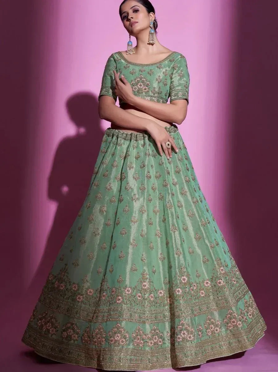 Mint green embroidered lehenga choli with gold detailing, perfect for Indian ethnic wear occasions