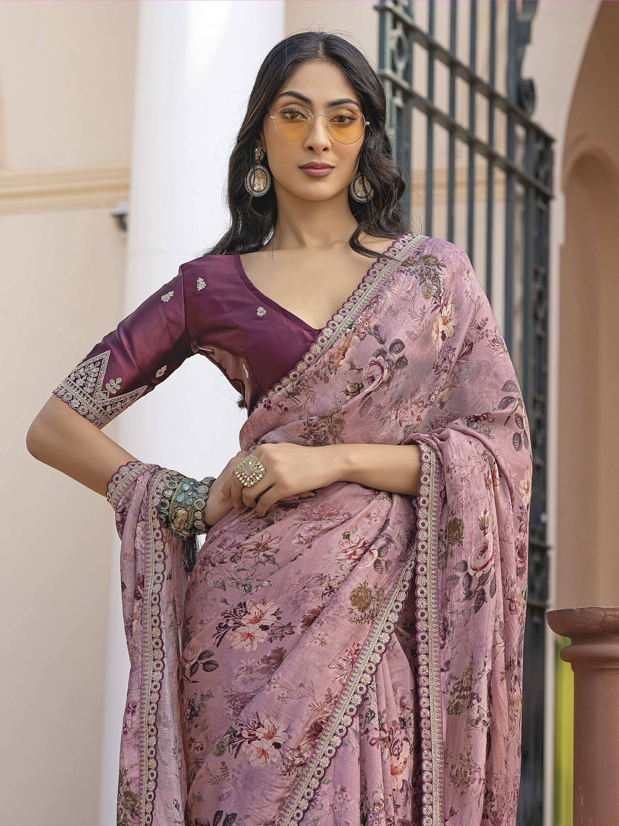 Elegant floral print saree with embroidered border and matching blouse, styled with statement jewelry.