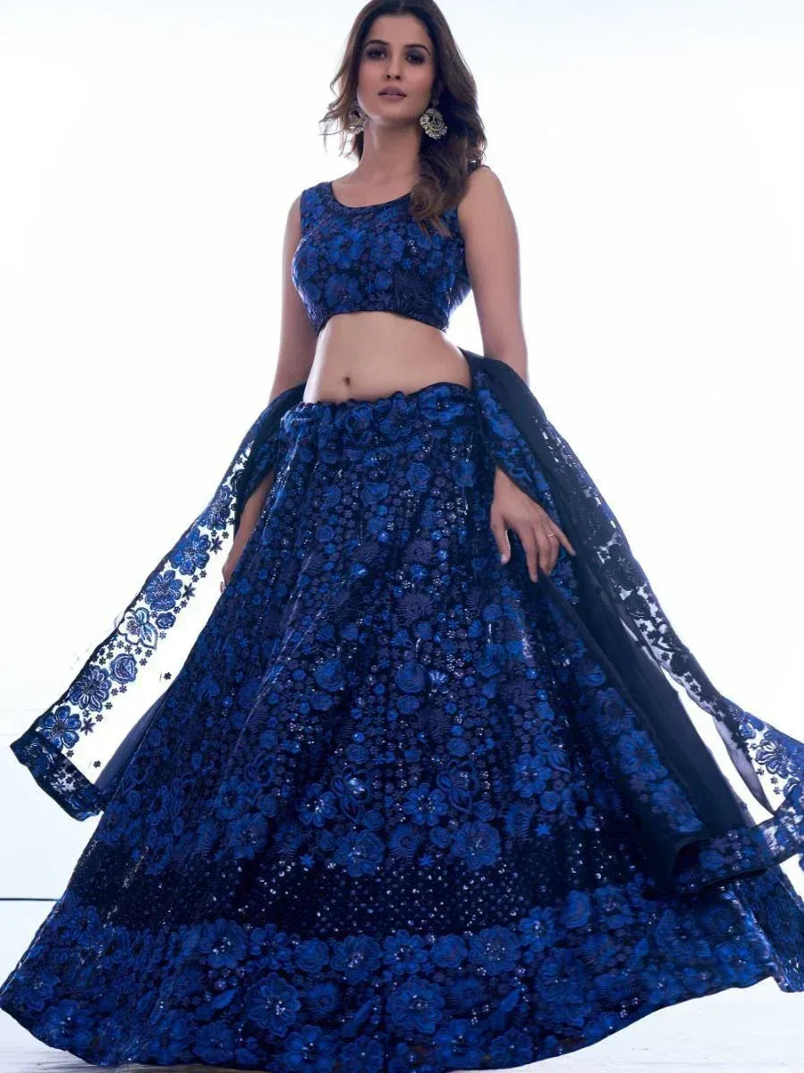Royal blue floral embroidered lehenga choli with sheer dupatta, perfect for Indian weddings and festive occasions.