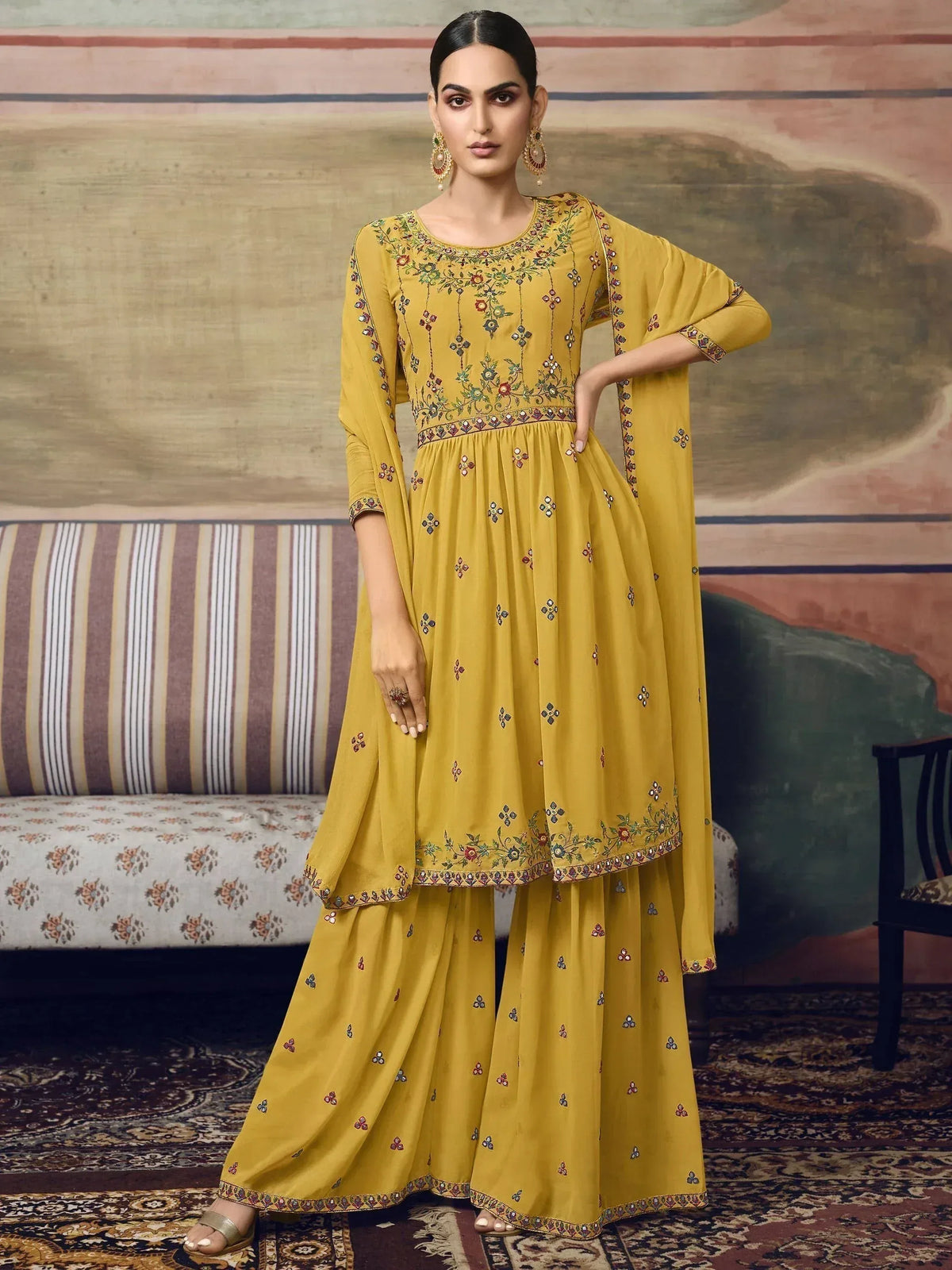 Yellow embroidered Anarkali suit with floral detailing, perfect for Indian ethnic wear occasions