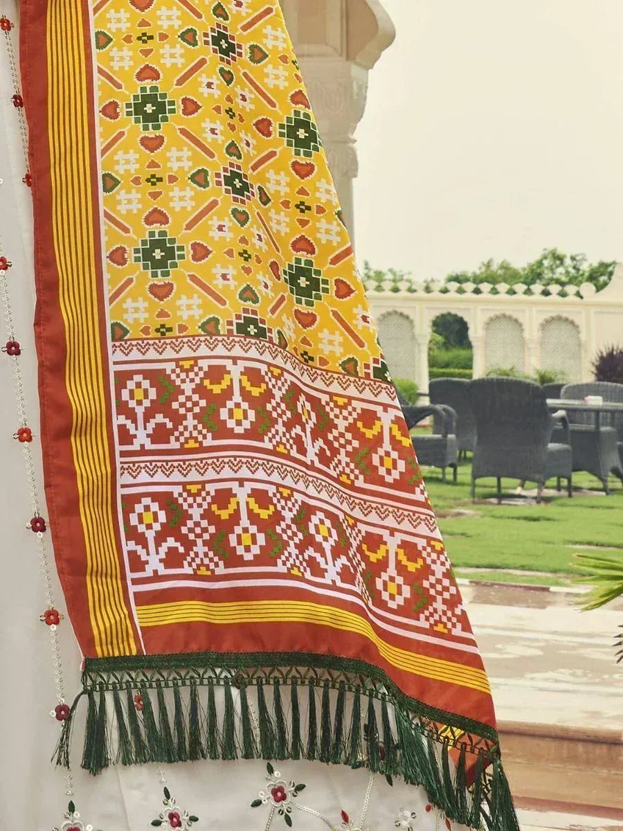 Vibrant yellow and red ethnic dupatta with geometric patterns and green tassels, perfect for Indian wear