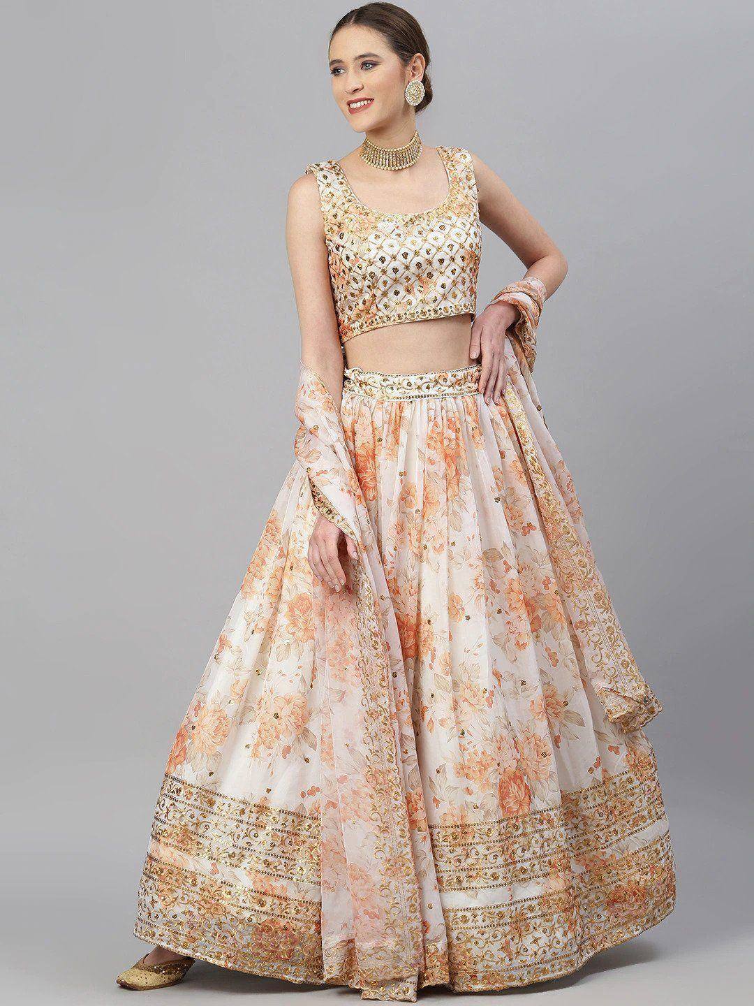 Elegant floral lehenga choli with gold embroidery, perfect for Indian weddings and festive occasions.