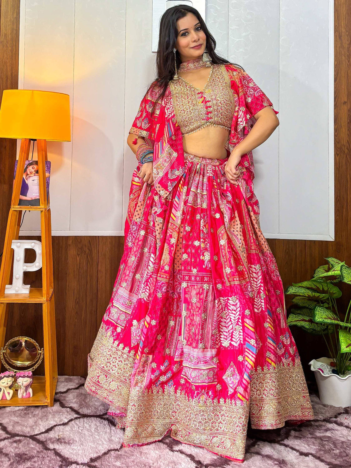 Pink embroidered lehenga choli with gold detailing, perfect for Indian ethnic wear
