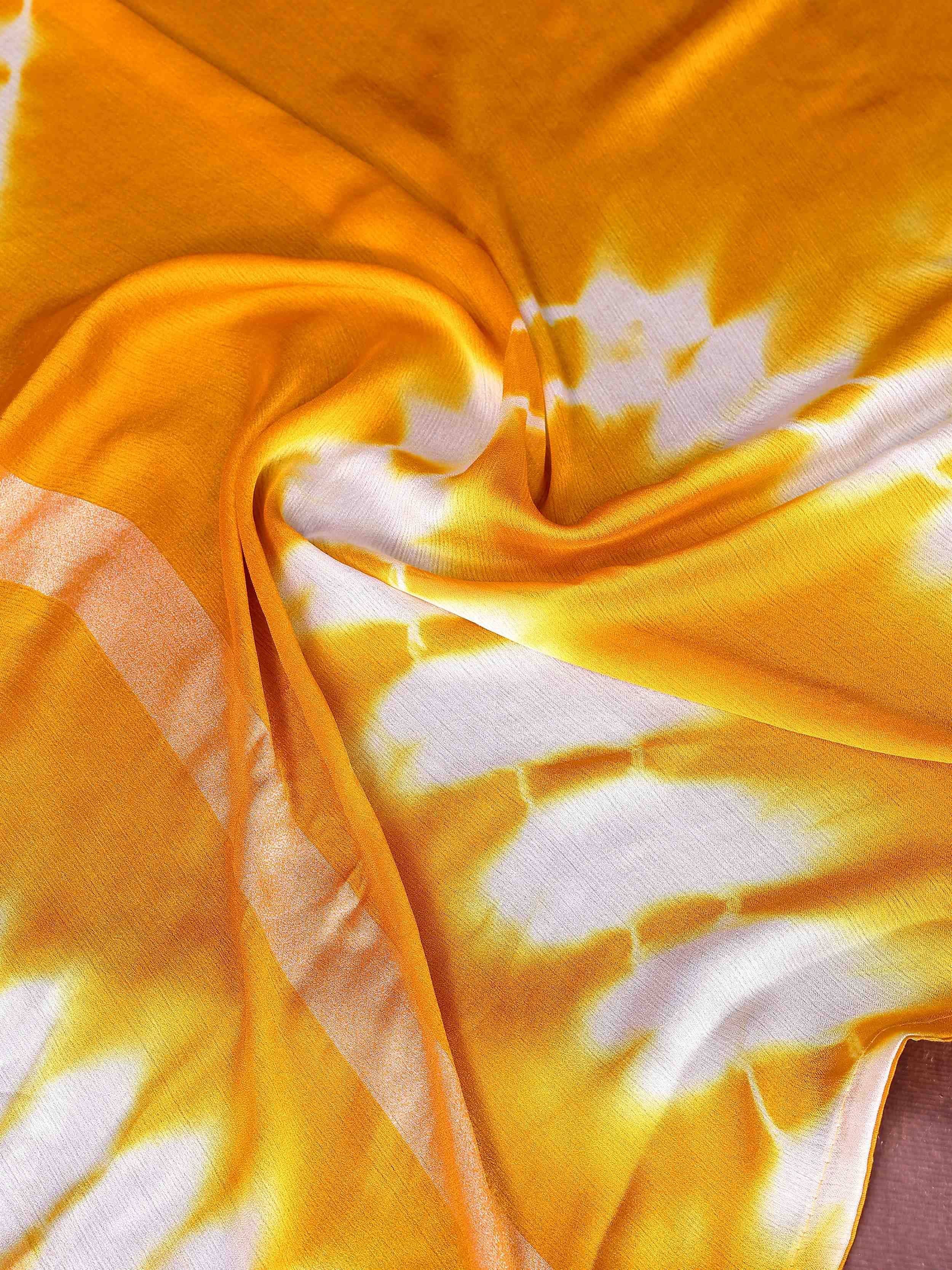 Vibrant yellow and white tie-dye fabric for ethnic wear, soft draping texture