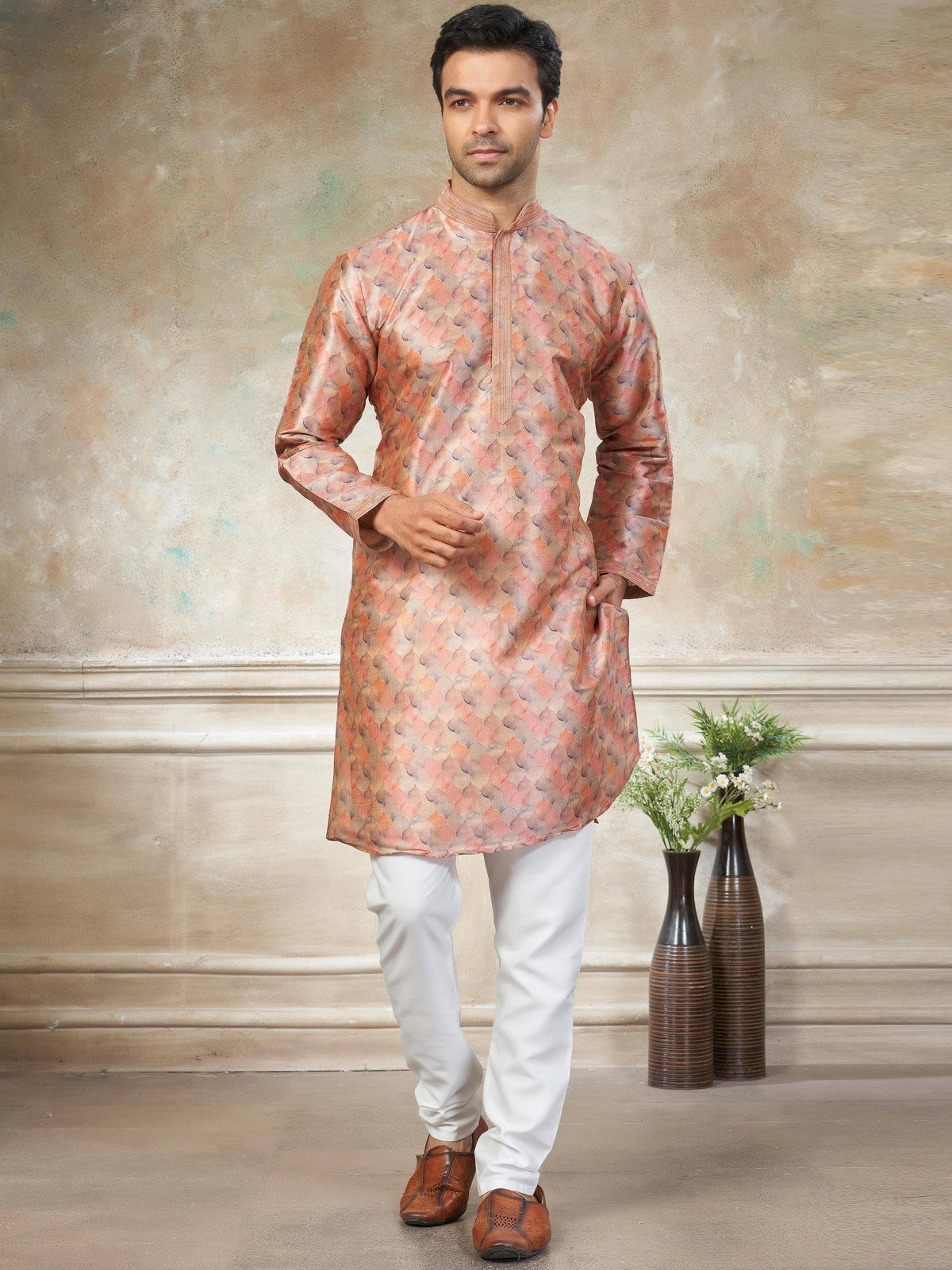 Men's ethnic kurta with peach scale print, paired with white churidar and brown mojris for festive occasions