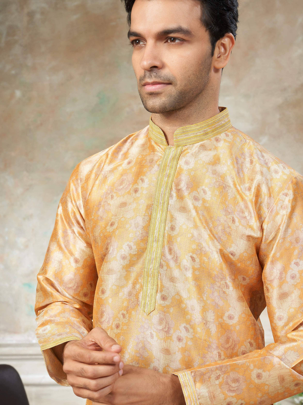 Men's yellow floral kurta with gold trim, ethnic wear for festive occasions