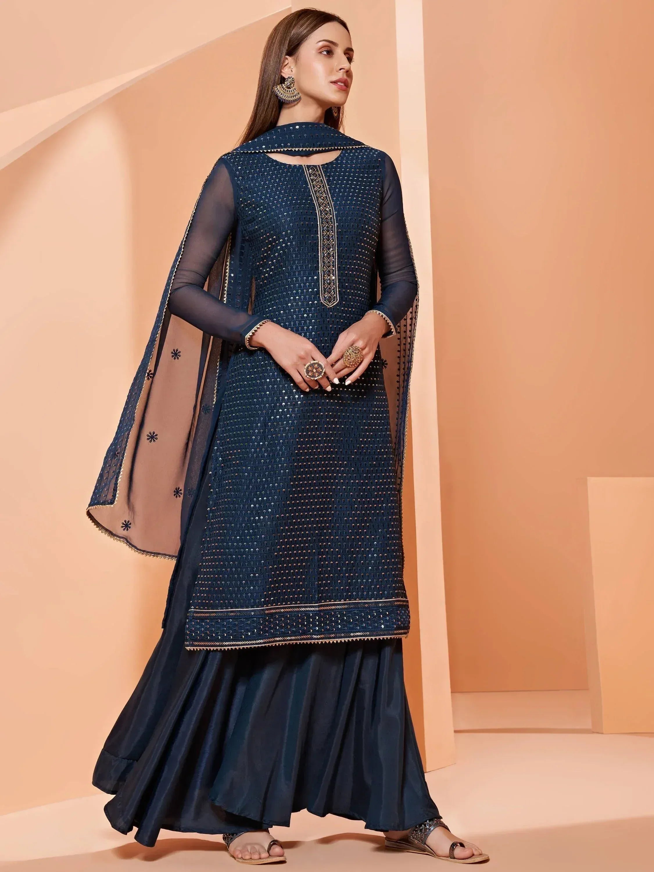 Elegant navy blue ethnic gown with sequin detailing and sheer dupatta for festive occasions