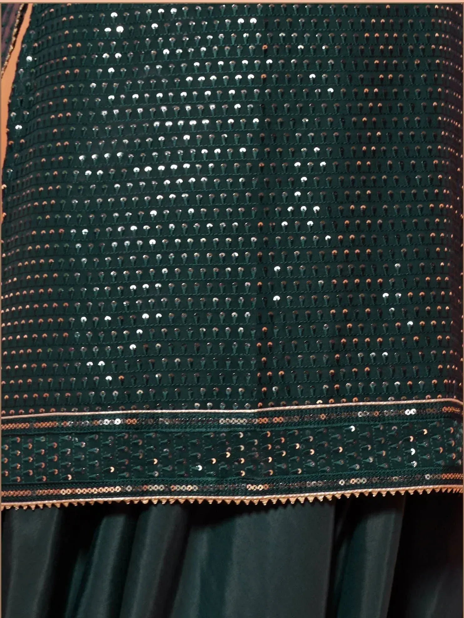 Emerald green ethnic gown with sequin embellishments and golden border detailing