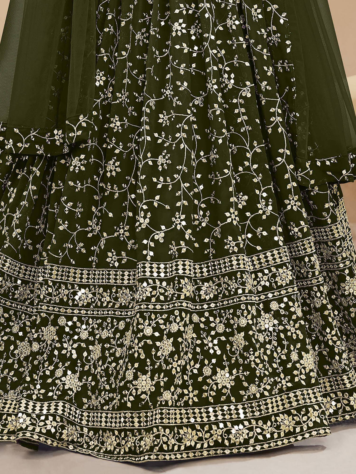 Olive green lehenga with intricate silver floral embroidery and sequin detailing