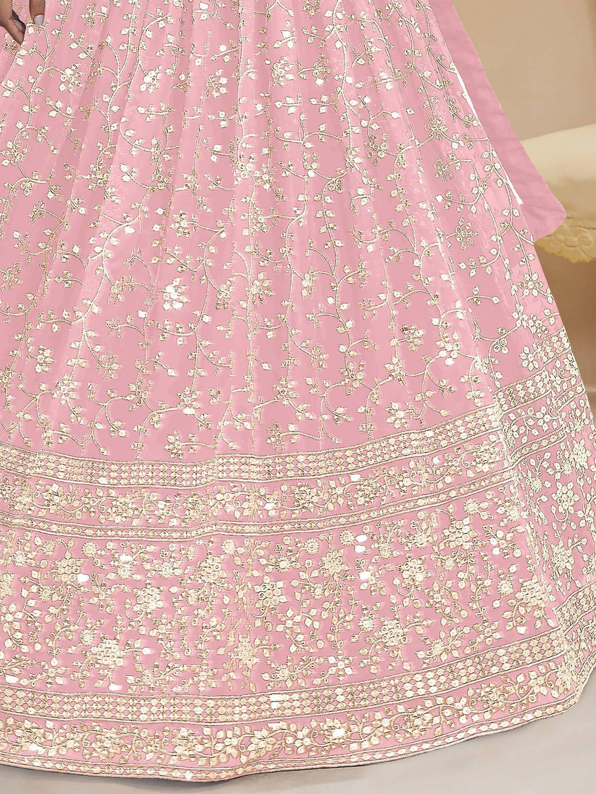 Pink lehenga with gold floral embroidery and intricate border design