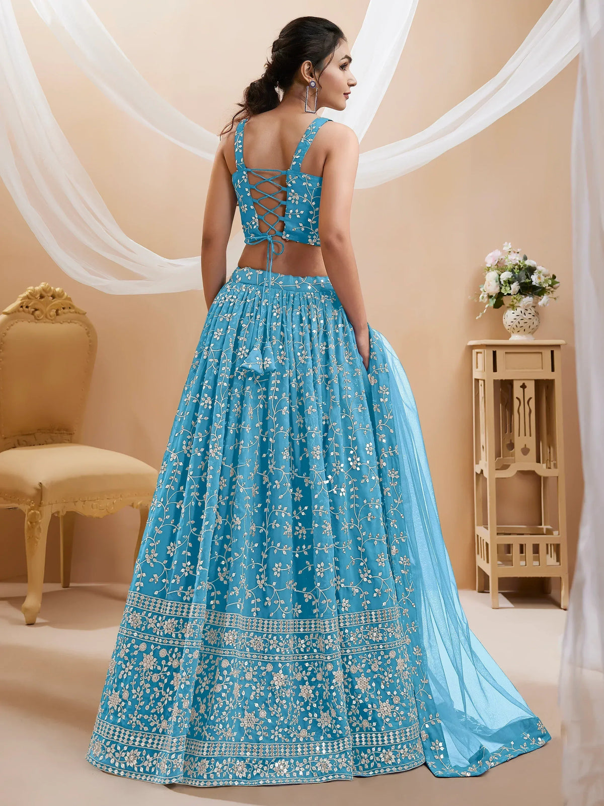 Blue embroidered lehenga choli with lace-up back, perfect for Indian ethnic wear occasions