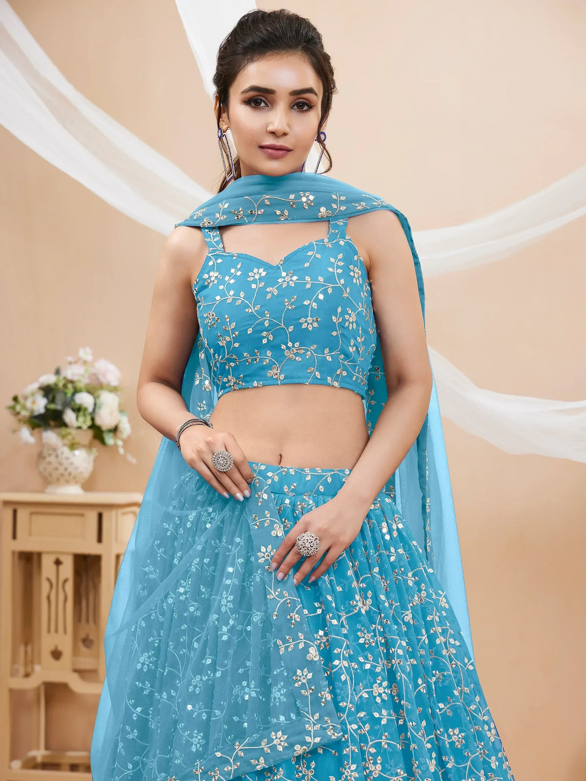 Blue embroidered lehenga choli with floral design, perfect for Indian ethnic wear occasions