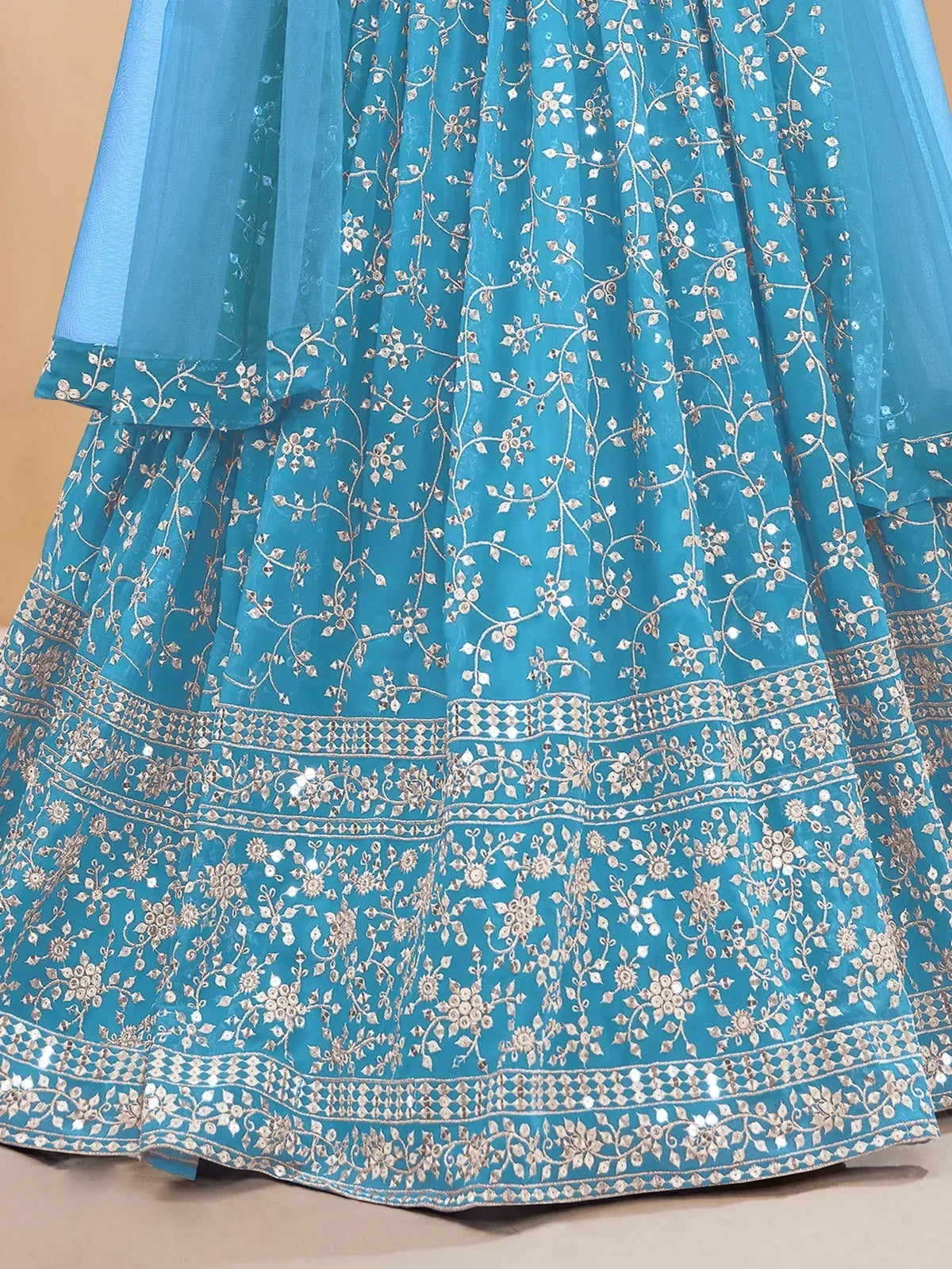 Turquoise lehenga with intricate silver floral embroidery and sequin detailing for Indian ethnic wear