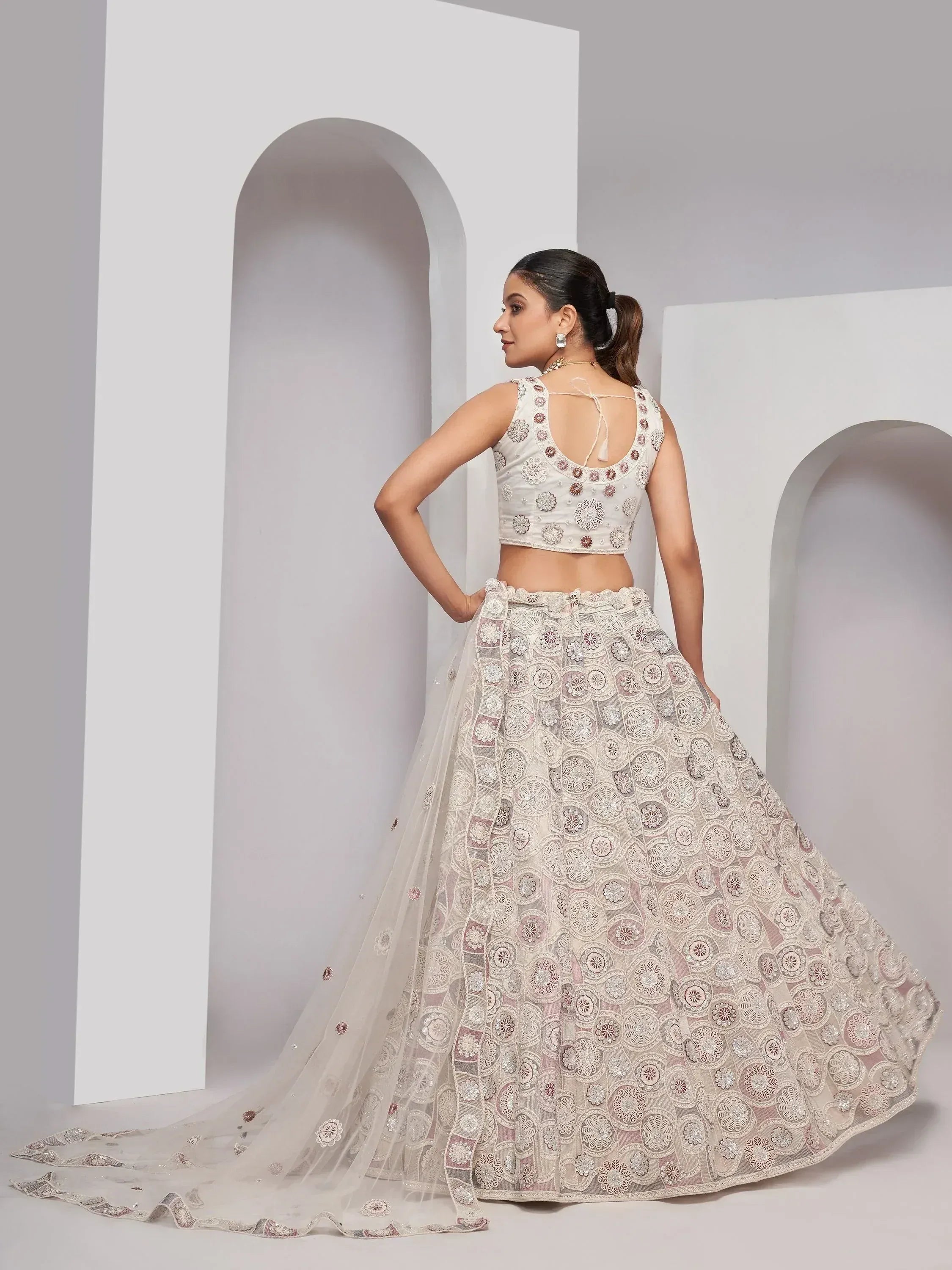 Elegant white lehenga choli with floral embroidery, perfect for Indian ethnic wear occasions