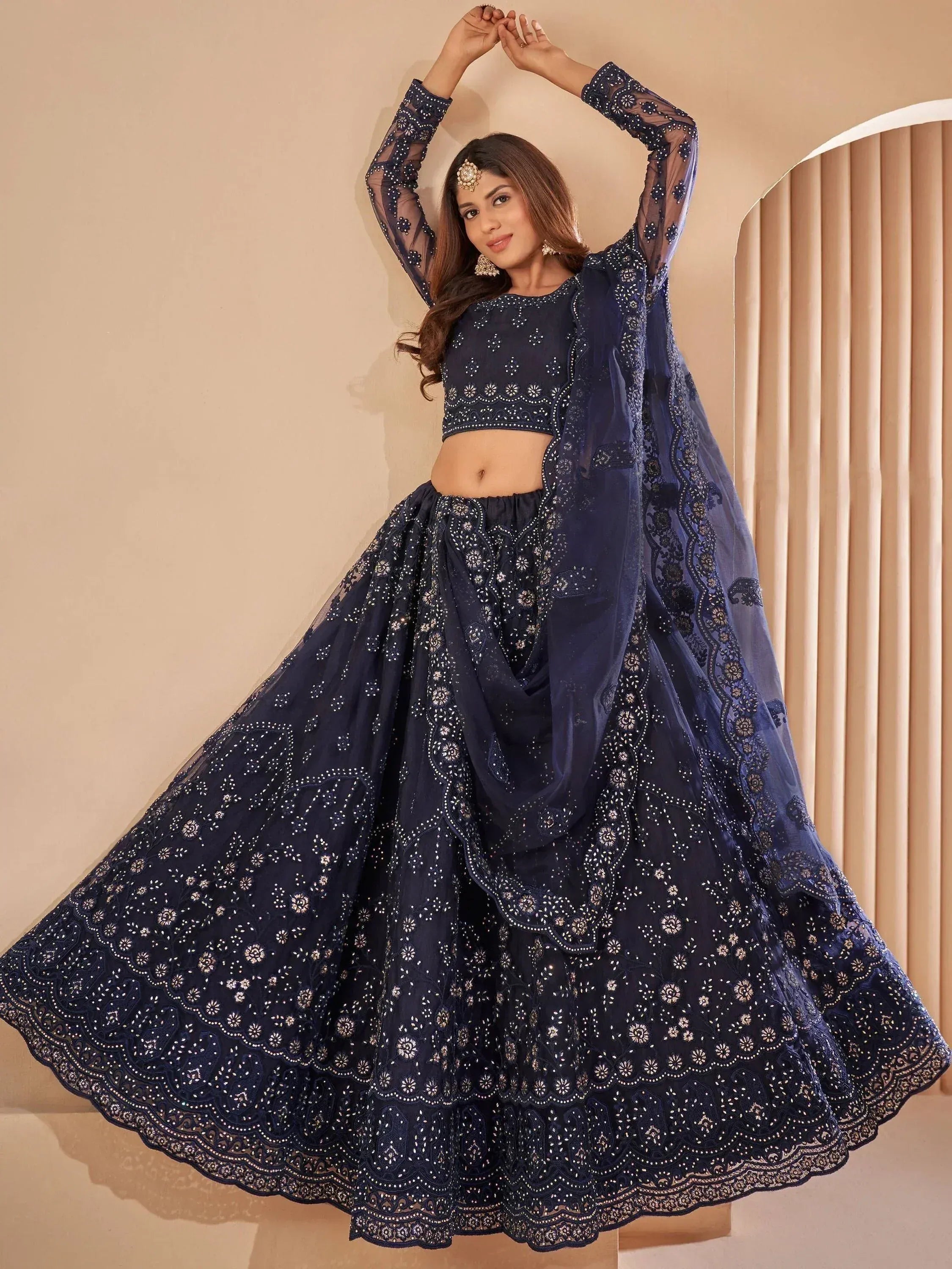 Navy blue embroidered lehenga choli with sheer sleeves and dupatta, perfect for Indian ethnic occasions